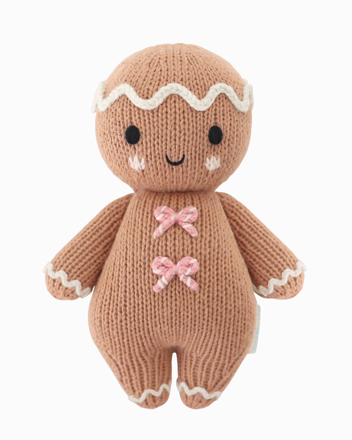 Baby Gingerbread Candy Swirl plush doll from Cuddle + Kind featuring a cute gingerbread baby with colorful candy swirl details.