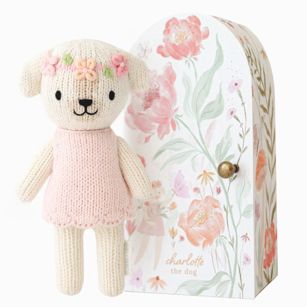 Tiny Charlotte the Dog plush toy by Cuddle + Kind, with soft fur and detailed features, designed for cuddling and play.