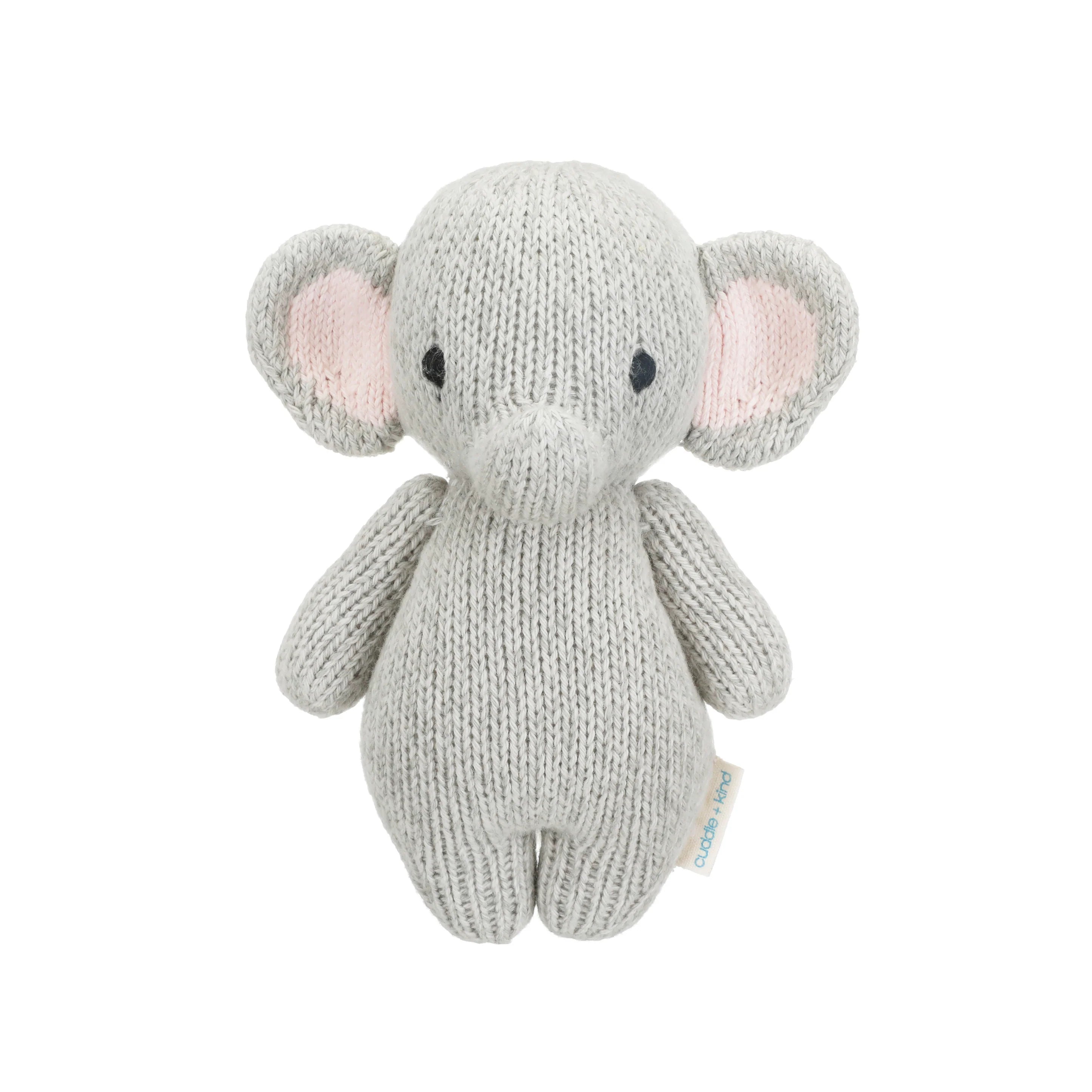Soft baby elephant plush toy from Cuddle + Kind featuring detailed gray fabric and gentle expression for infants.