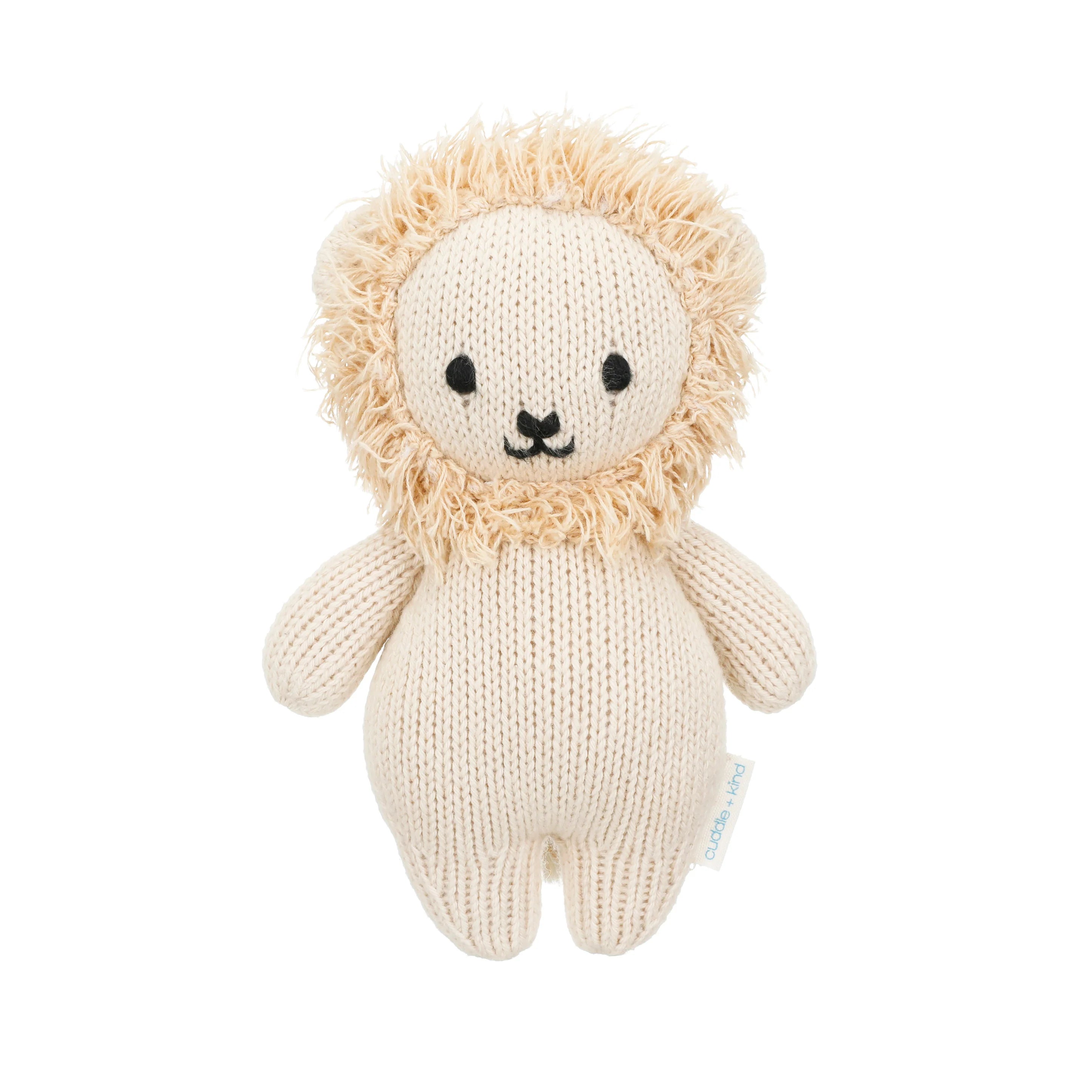 Soft plush baby lion toy from Cuddle + Kind, featuring a gentle lion design with a friendly face and detailed fur texture.