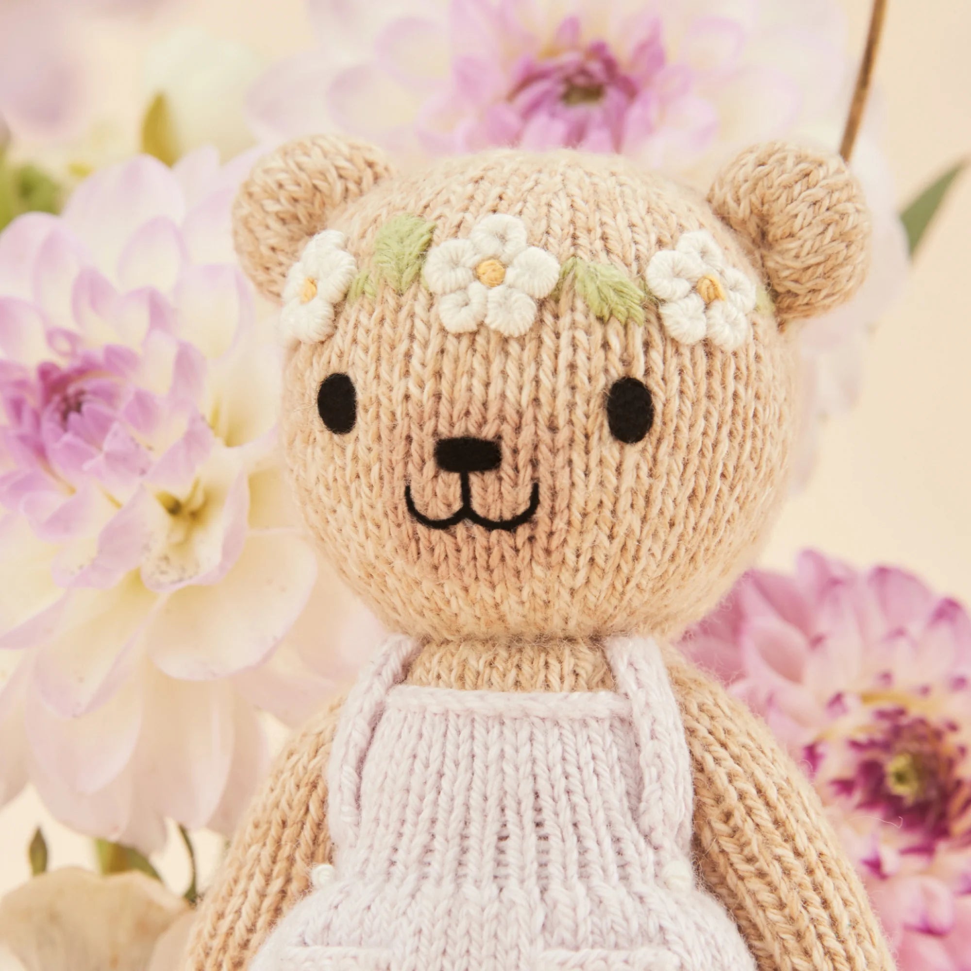 Tiny Olivia the Honey Bear plush toy by Cuddle + Kind featuring soft fabric and adorable bear design for children.