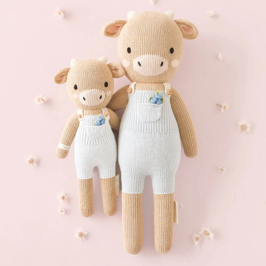 Asher the Cow plush toy by Cuddle + Kind featuring soft fabric and detailed cow design, perfect for cuddling and comfort.