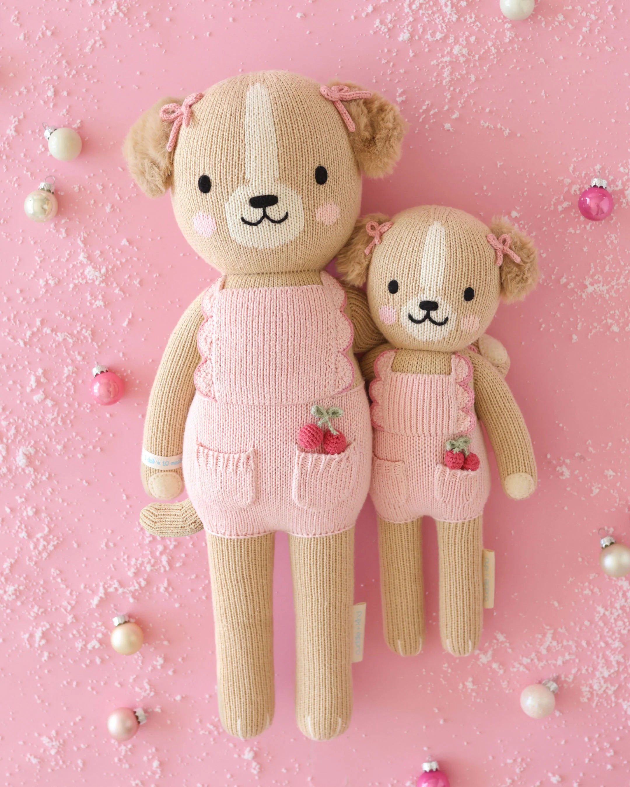 Soft plush toy of Nora the Golden Puppy from Cuddle + Kind, featuring realistic golden fur and adorable puppy details.