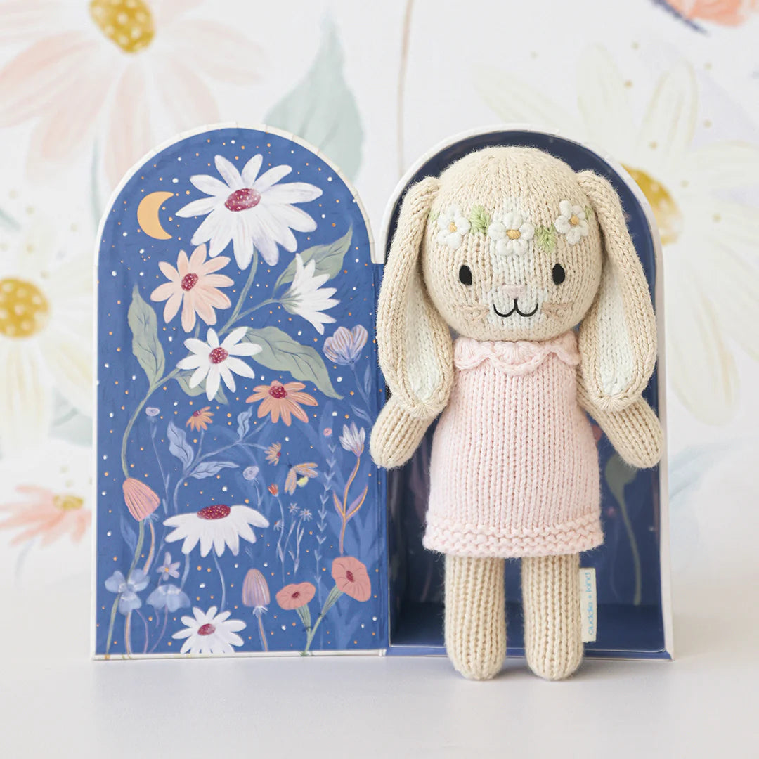Tiny Hannah the Bunny plush toy with blush pink fur from Cuddle + Kind, featuring soft details and adorable bunny ears.
