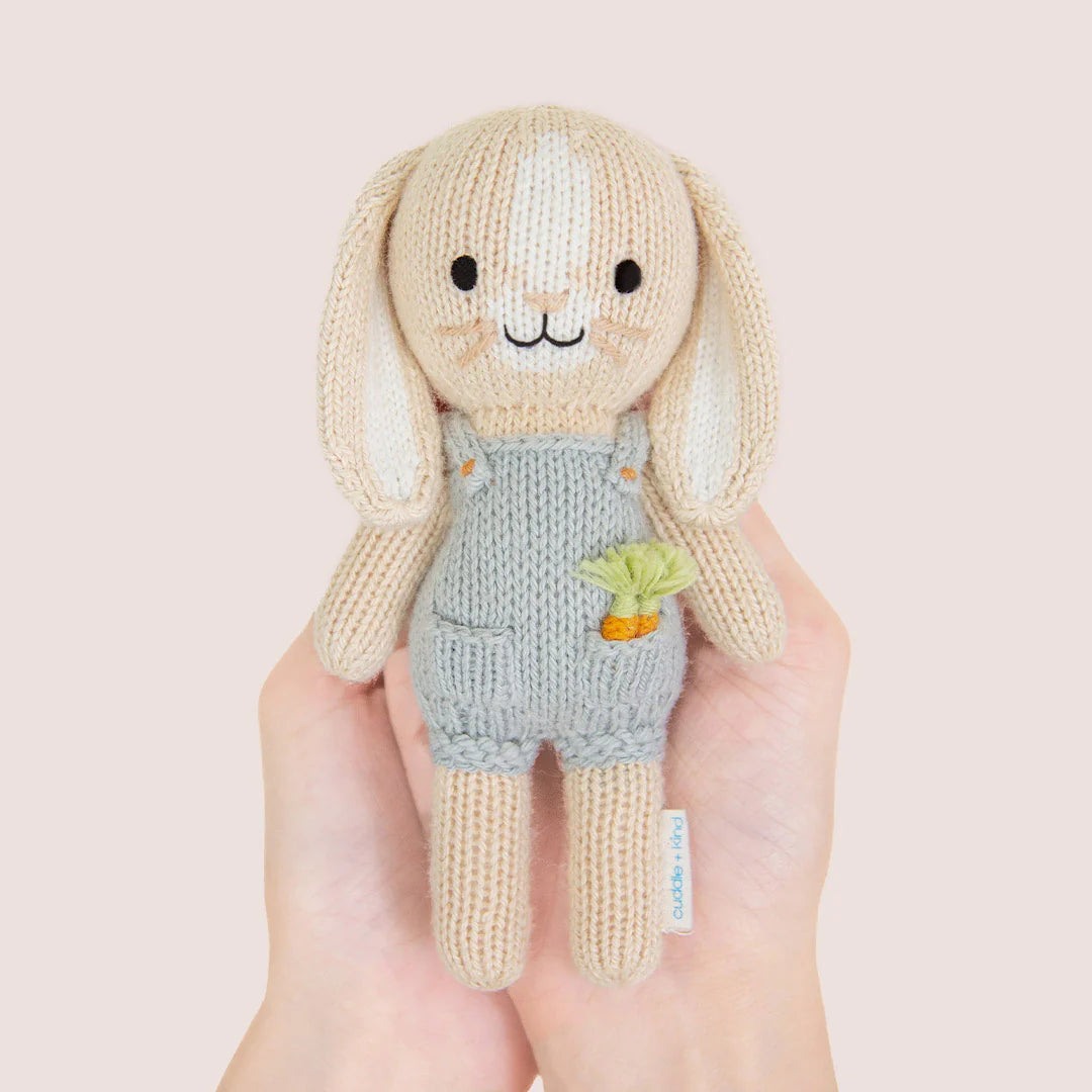 Soft plush Tiny Henry the Bunny toy from Cuddle + Kind, featuring realistic bunny details and a gentle expression.
