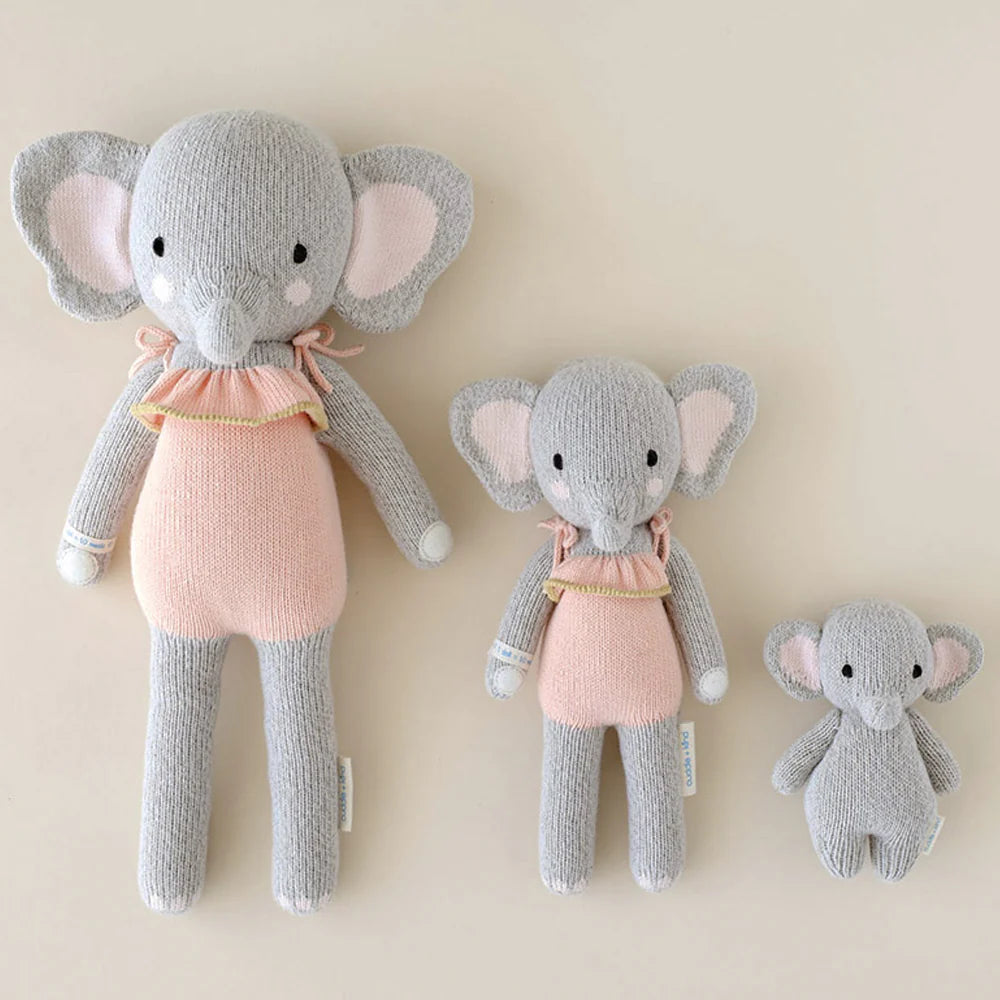 Soft baby elephant plush toy by Cuddle + Kind, featuring detailed gray fur and gentle expression for cuddling and play.