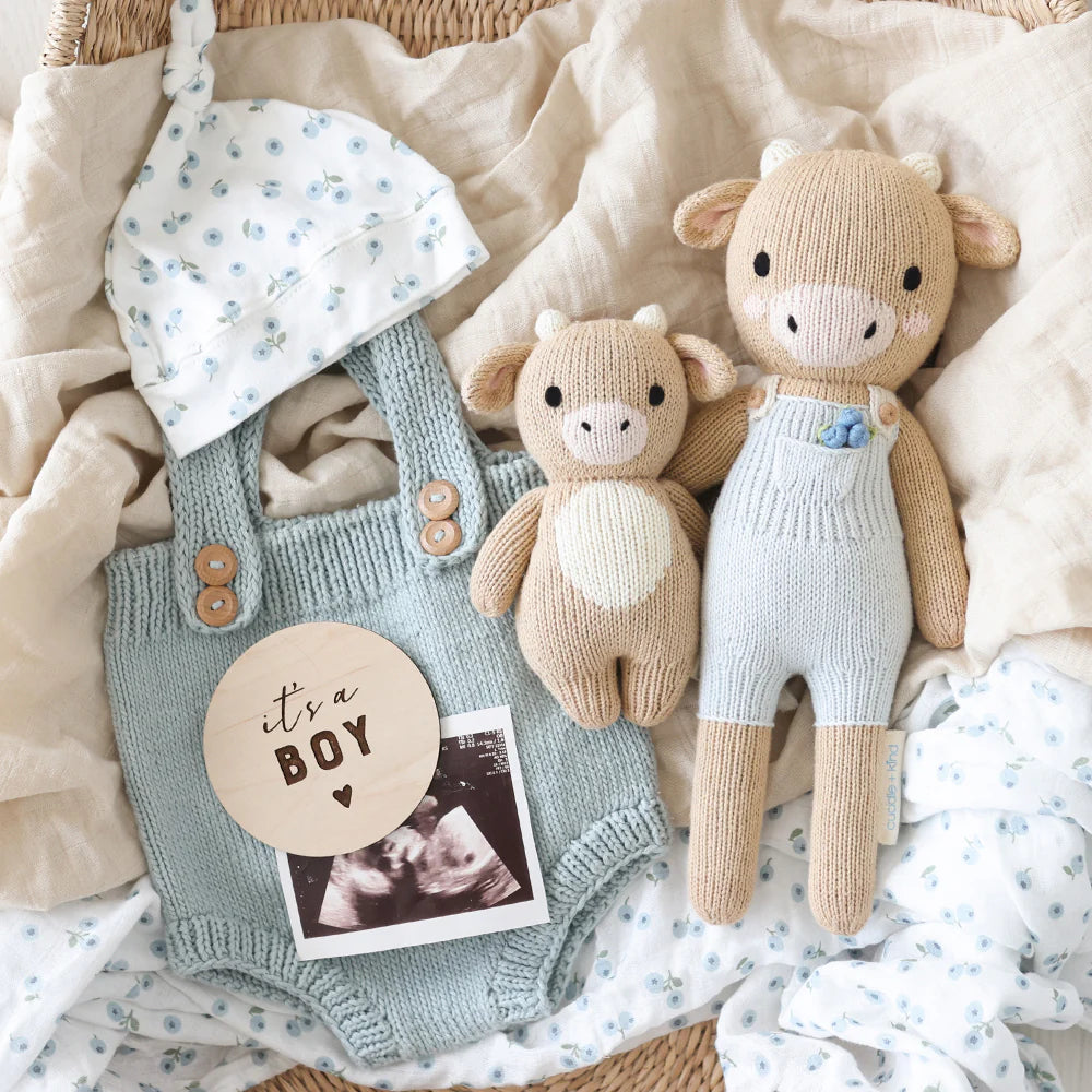 Asher the Cow plush toy by Cuddle + Kind featuring soft fabric, detailed cow design, and gentle expression for children.