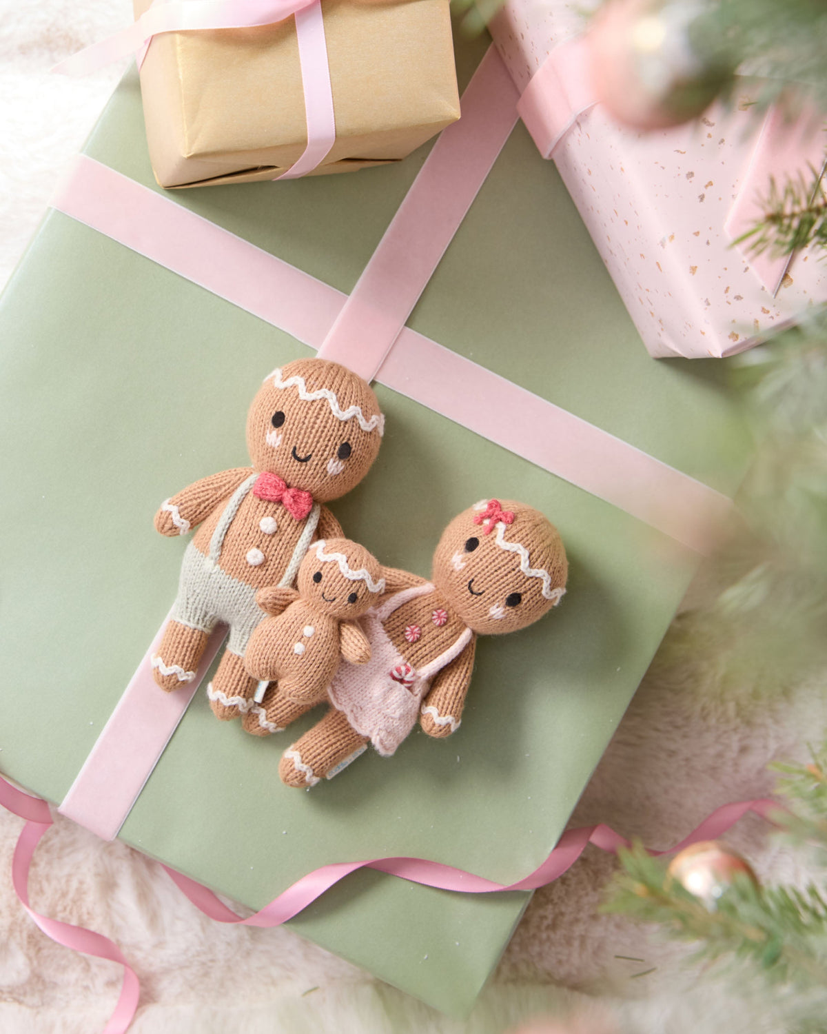 Tiny Gingerbread Sugarplum Girl plush toy by Cuddle + Kind featuring a sweet gingerbread girl with swirl details and soft fabric.