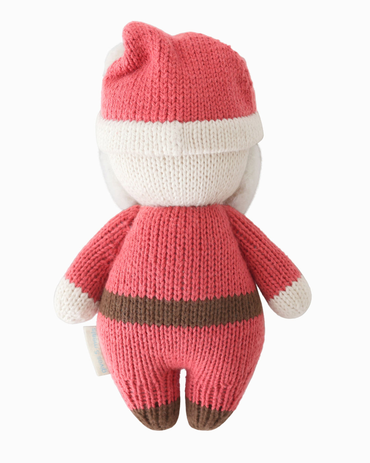 Soft plush Baby Santa doll by Cuddle + Kind in jolly red outfit, featuring a cute Santa face and detailed holiday costume.