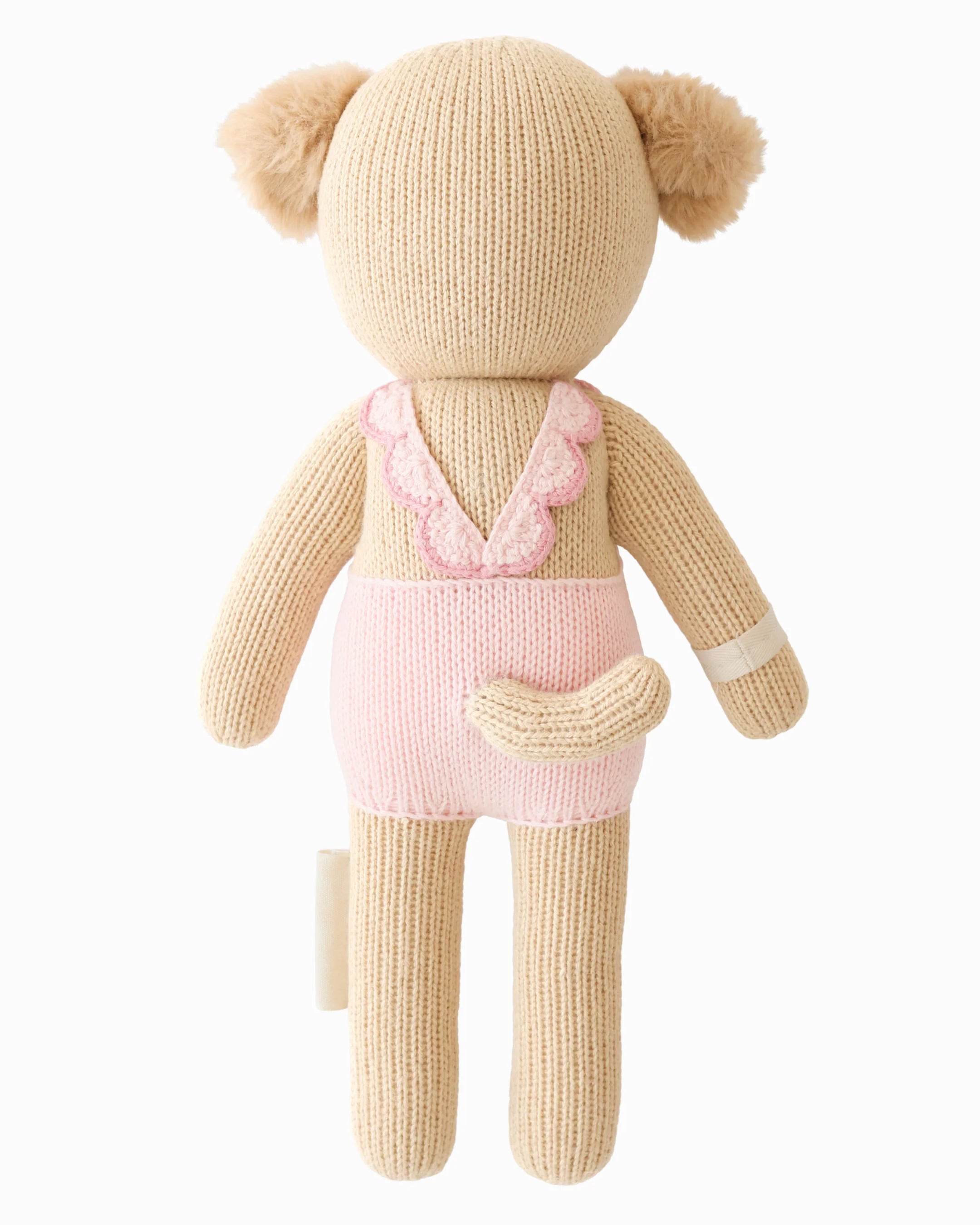 Soft plush Nora the Golden Puppy from Cuddle + Kind, featuring detailed golden fur and gentle eyes, ideal for cuddling and play.
