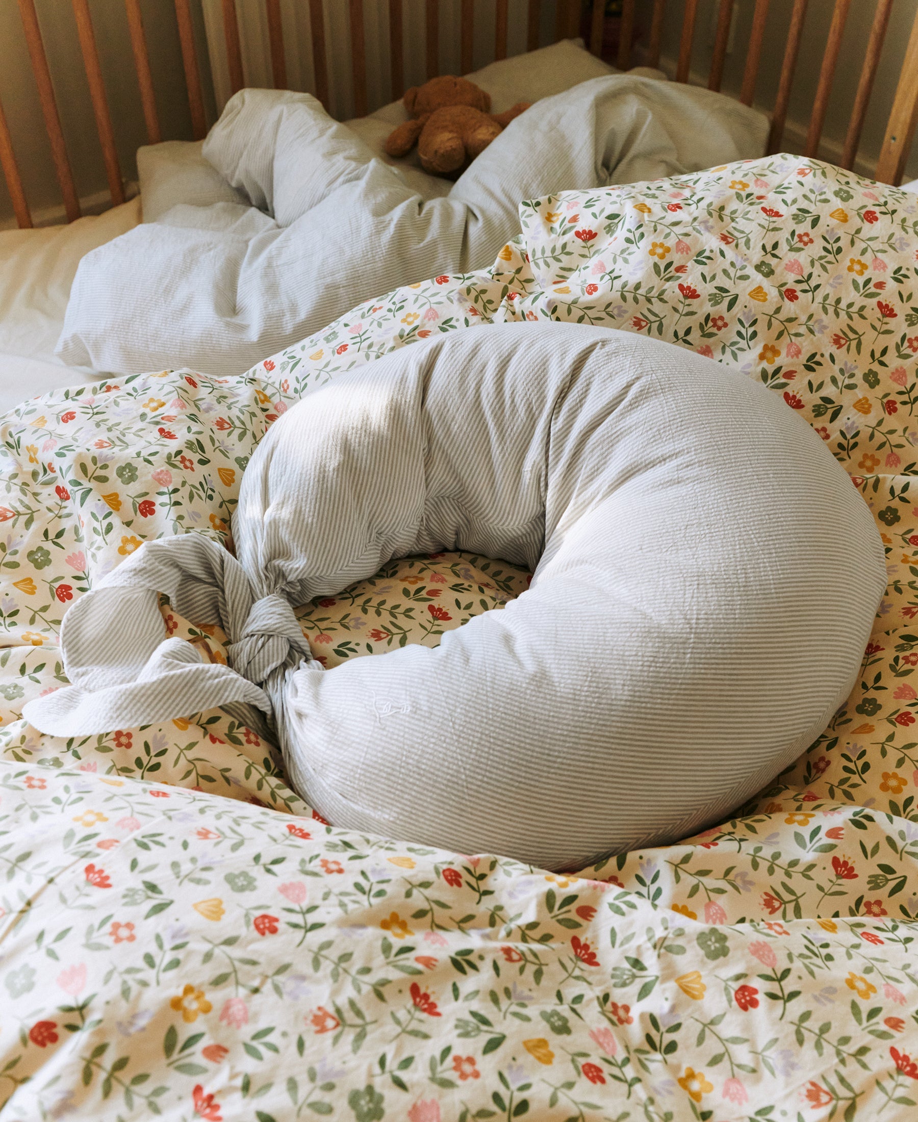 Dear April Nami Nursing Pillow in Dew Stripe, styled with long ties.