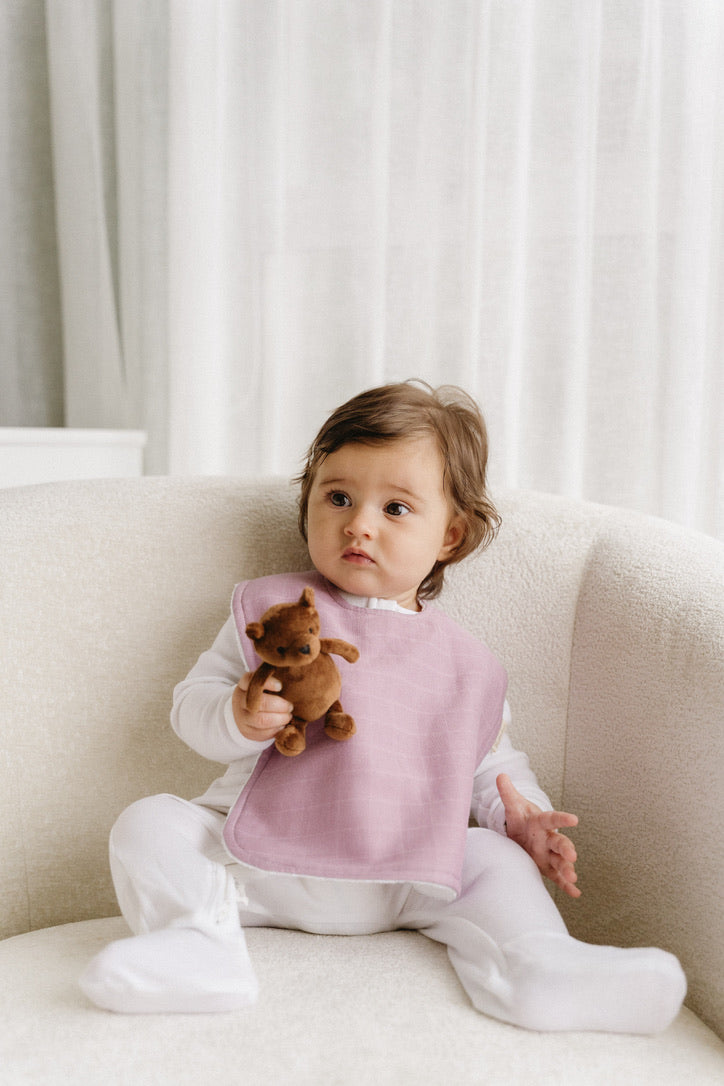 Bubbadue oversized pale blue feeding bib with waterproof material and adjustable neck strap for infants.