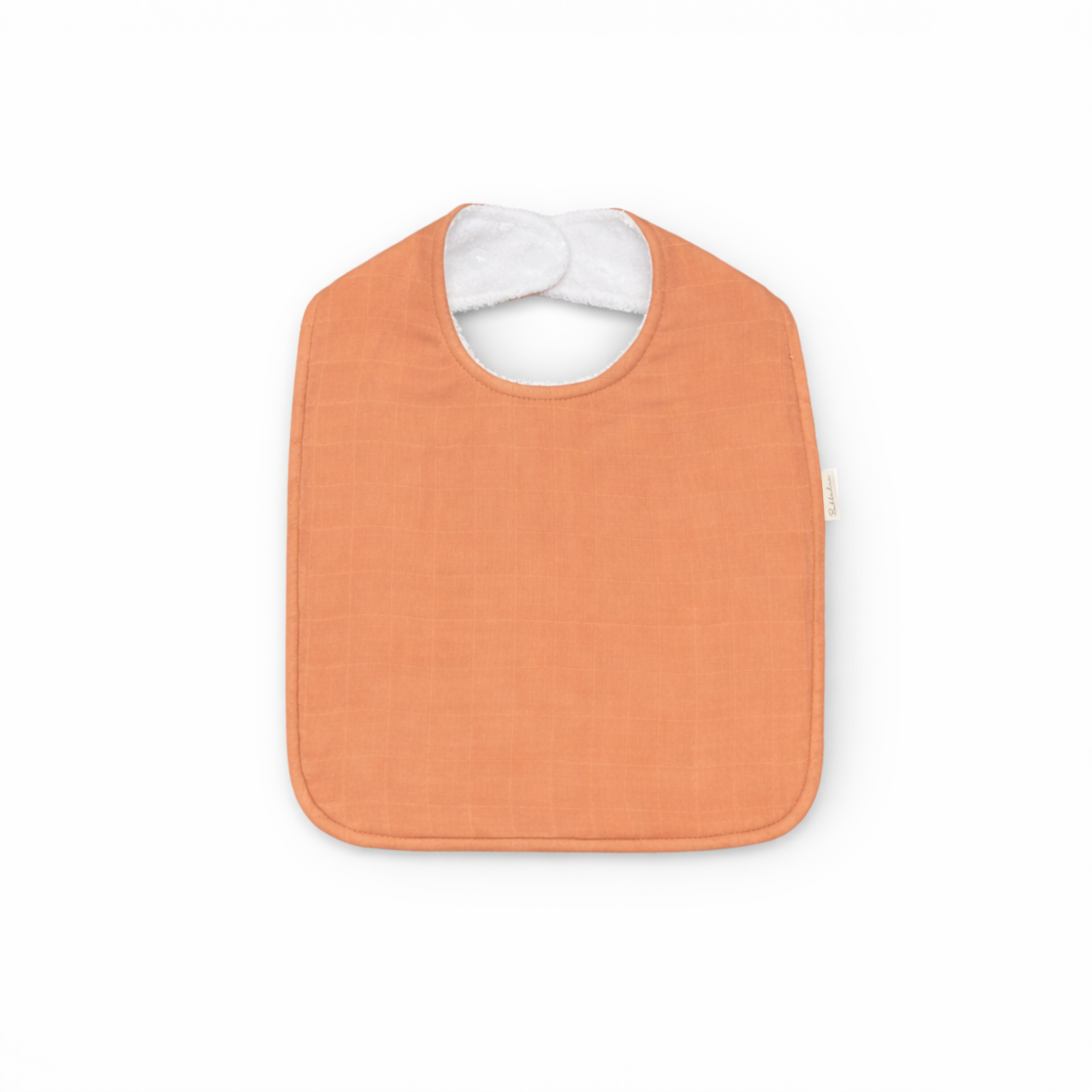 Rust oversized feeding bib by Bubbadue, showing a soft, waterproof fabric with a large coverage design for messy eaters.