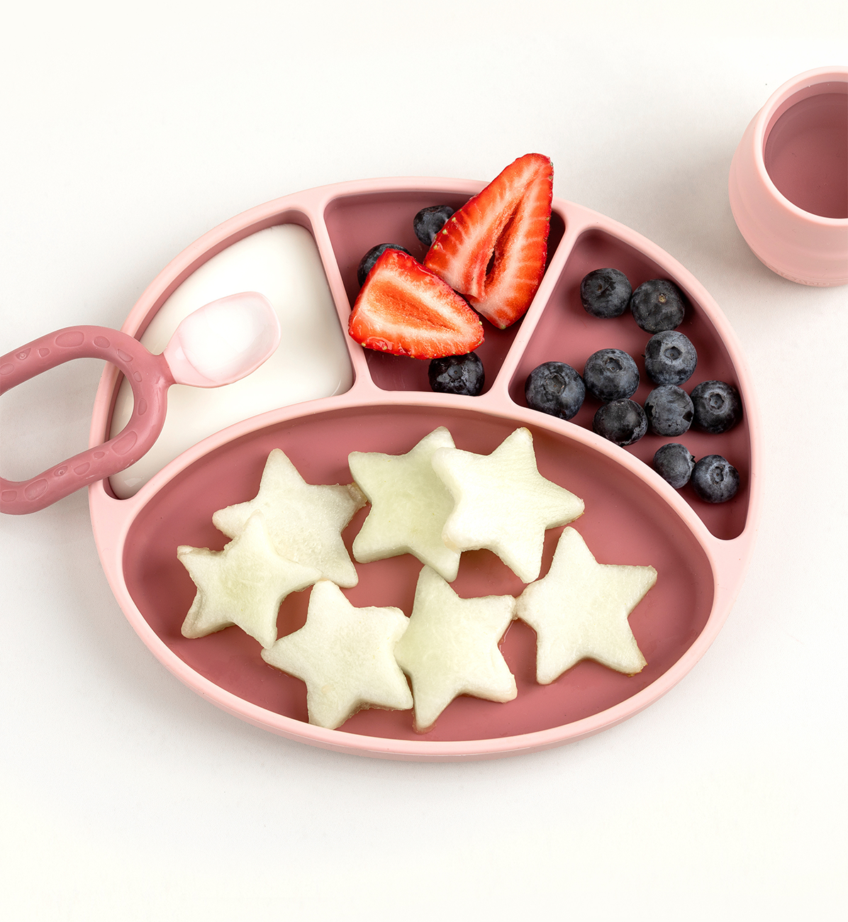 Bibado silicone suction divider plate in blush color, featuring multiple compartments for easy mealtime organization for kids.