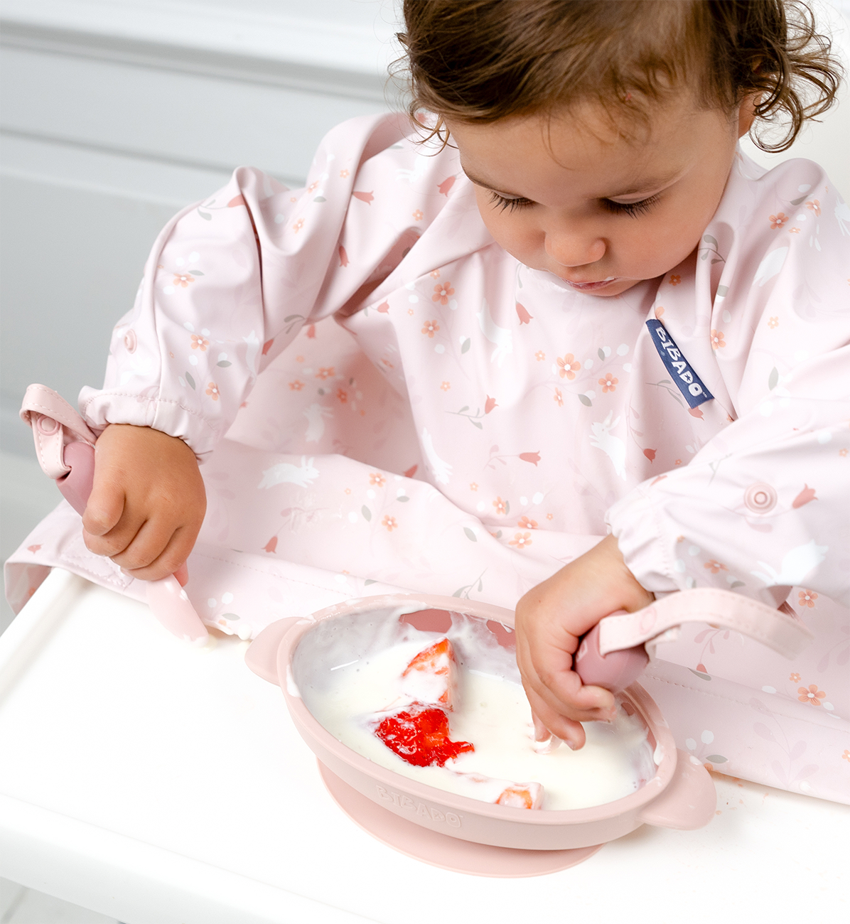 Pink Bibado Silicone Suction Bowl with a wide base and smooth surface, designed for easy feeding and mess-free mealtime.