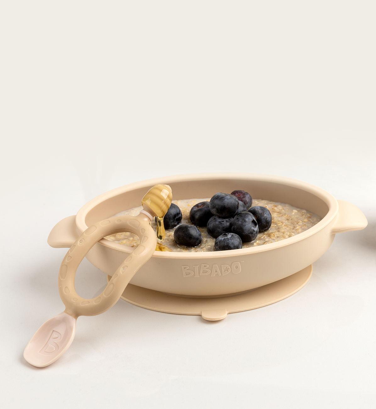 Bibado silicone suction bowl in fawn color with secure suction base, ideal for toddler mealtime feeding.