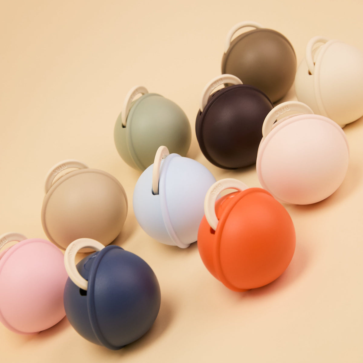 Gnash BIBS Pacifier Case Mini in Petal color, compact accessory for storing baby pacifiers, with a soft, stylish design.