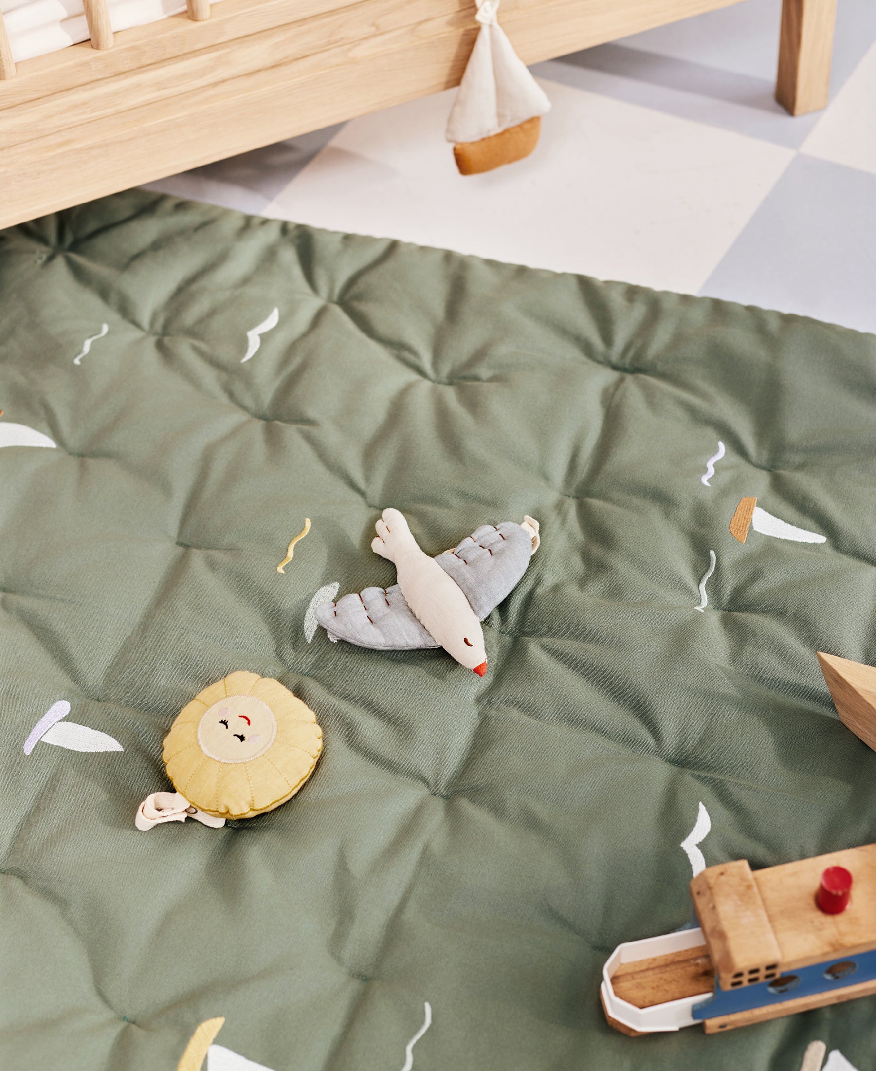 Dear April Meri Play Mattress with sailboat print, soft cushioned play mattress for kids' comfort and fun.