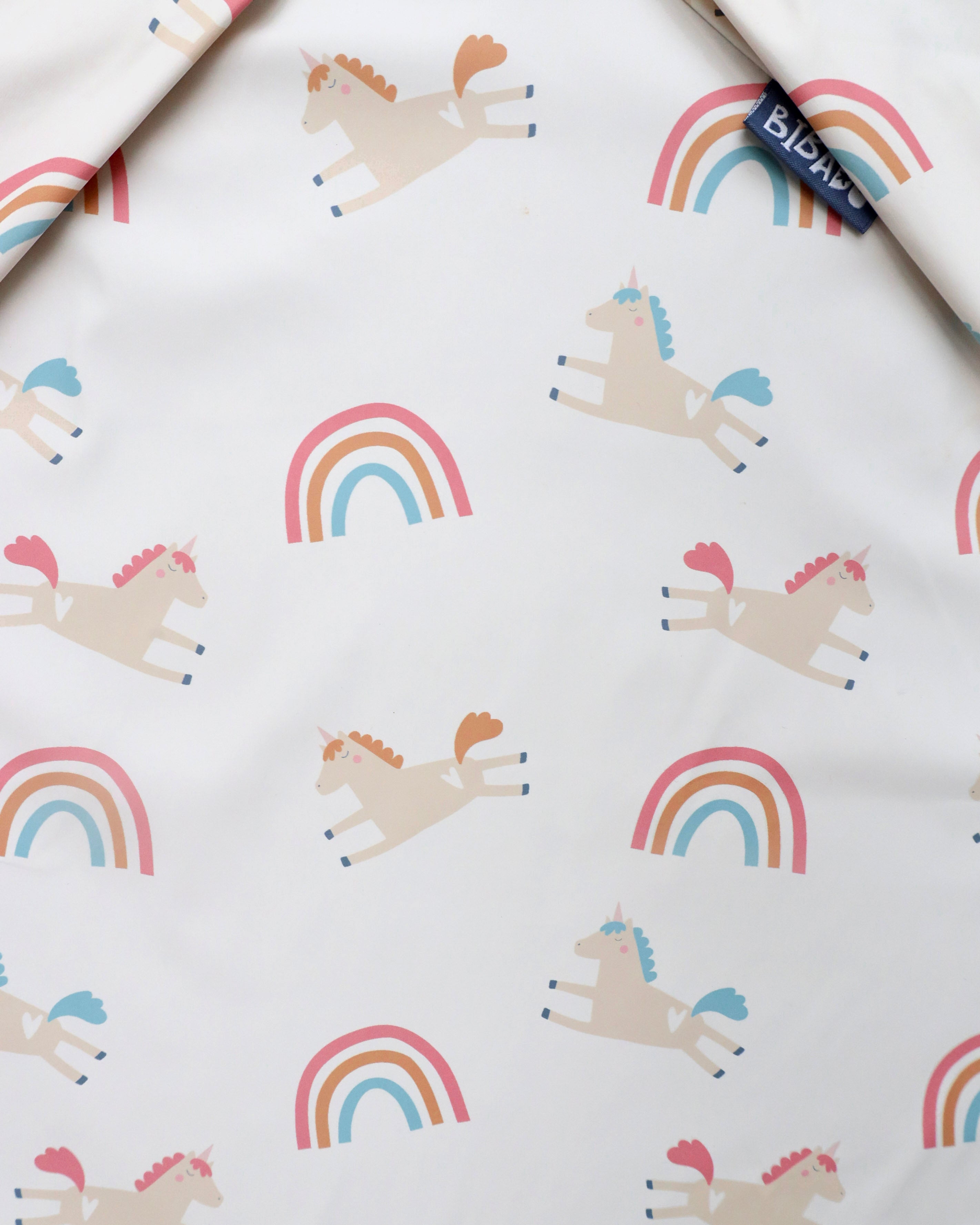 Close-up of Bibado Fairytale Foodies Weaning Bib coverall with playful fairytale food-themed design and adjustable neck strap.