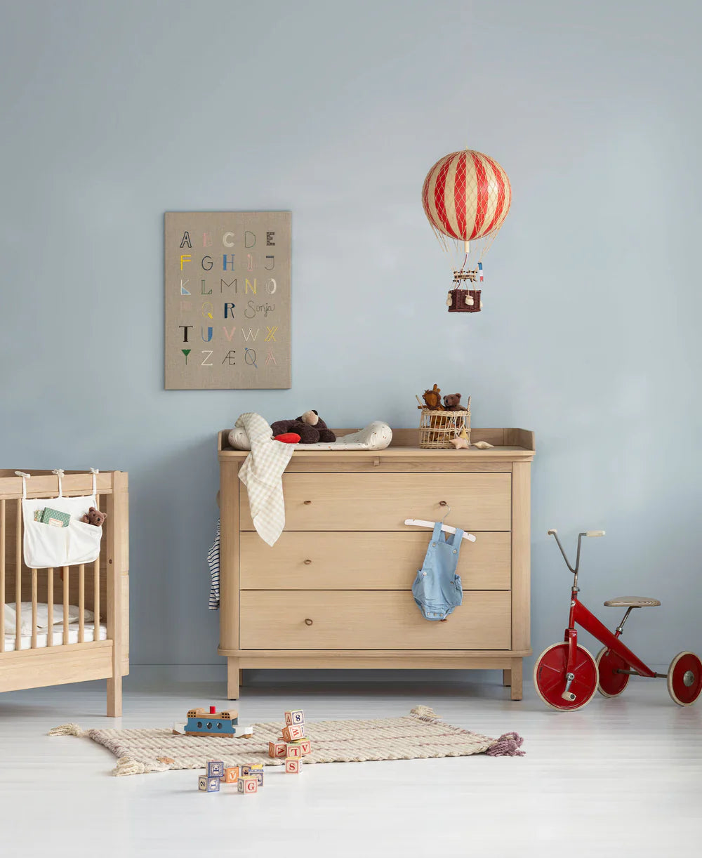 Wood nursery dresser with three drawers in oak, crafted by Oliver Furniture, featuring a smooth finish and functional design.