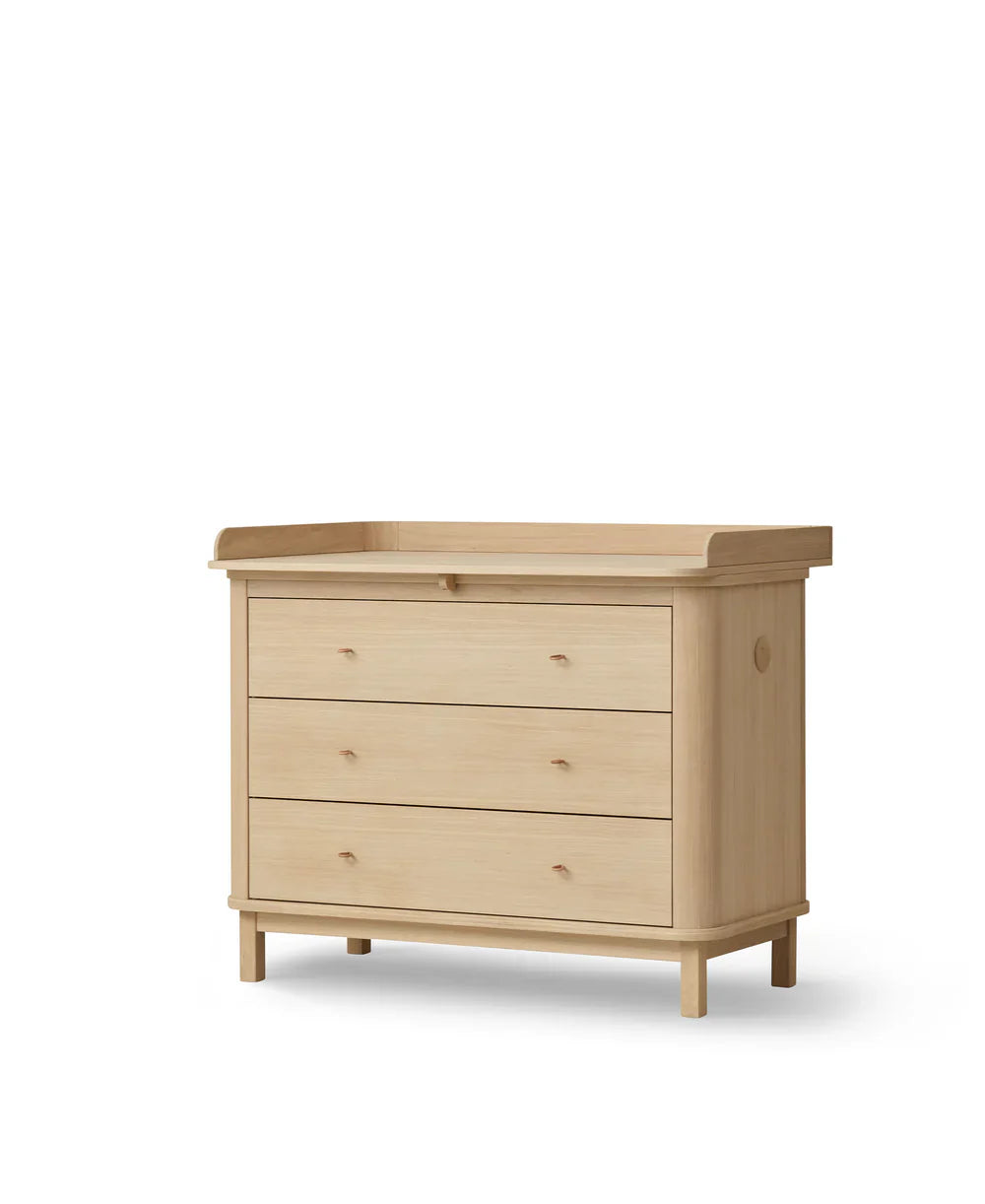 Oak wood nursery dresser with three spacious drawers by Oliver Furniture, showcasing a sleek and practical furniture piece for a child's room.