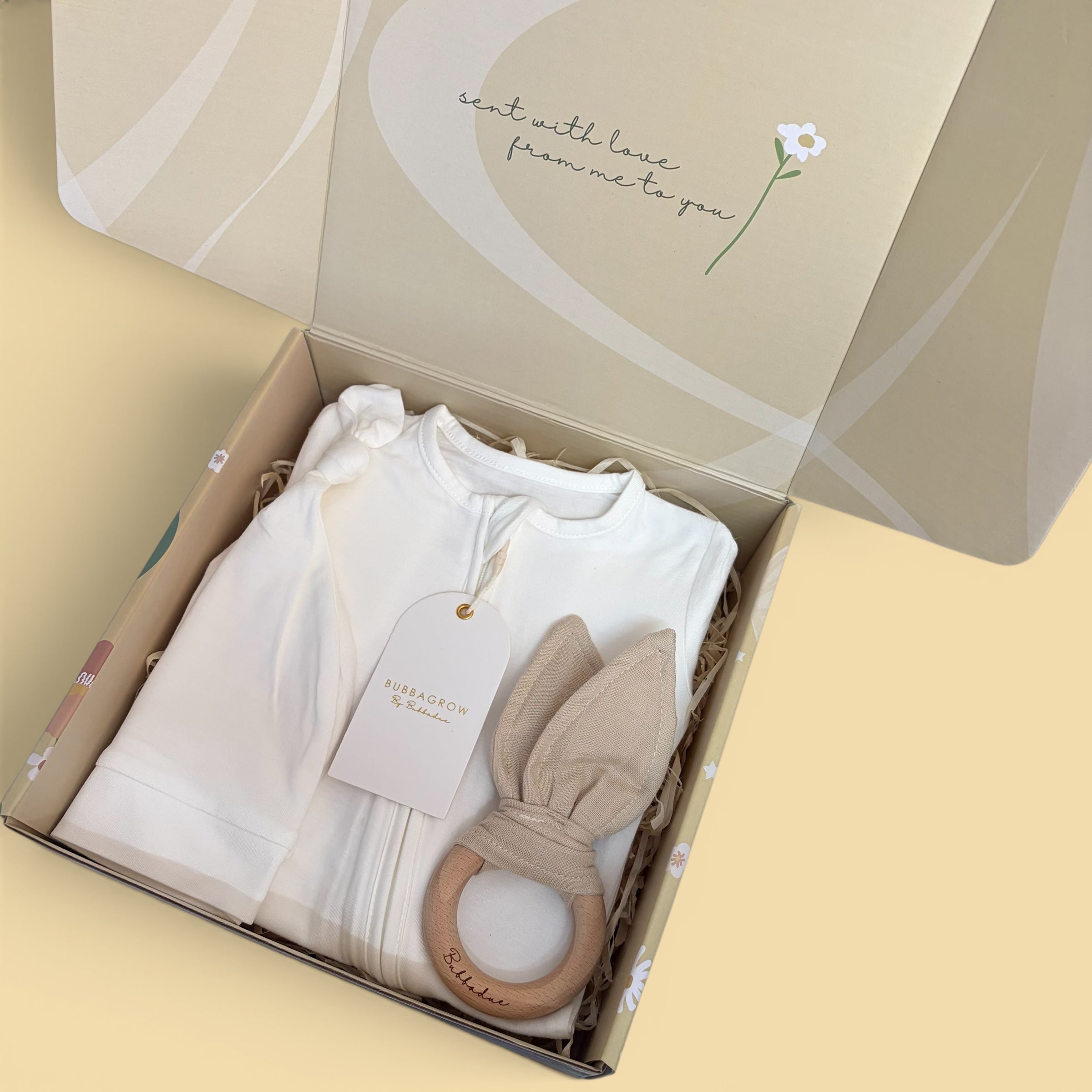 Luxury Baby Gift Box by Bubbadue featuring a elegant Bubbadue box with baby essentials and decorative elements.