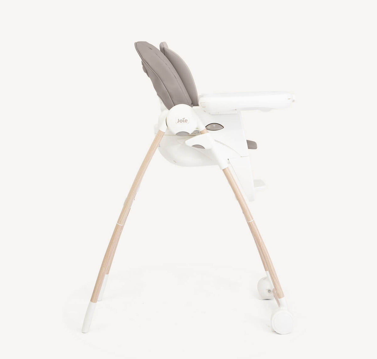 Joie Multiply 6-in-1 high chair in walnut wood, showing adjustable seat and tray for versatile baby feeding and seating.