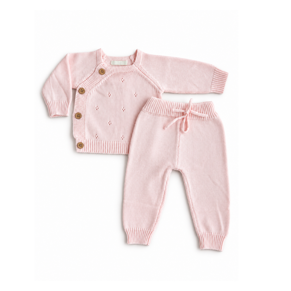 Baby and toddler knitted tracksuit in pale pink by Bubbadue, featuring soft, cozy knit fabric and a comfortable fit.