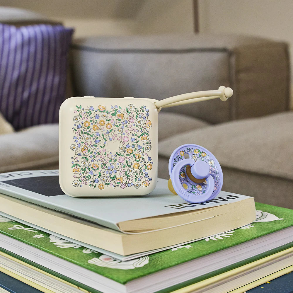 Gnash BIBS x LIBERTY pacifier box in Ivory with Chloe Meadow floral pattern, showcasing a compact, decorative accessory for babies.