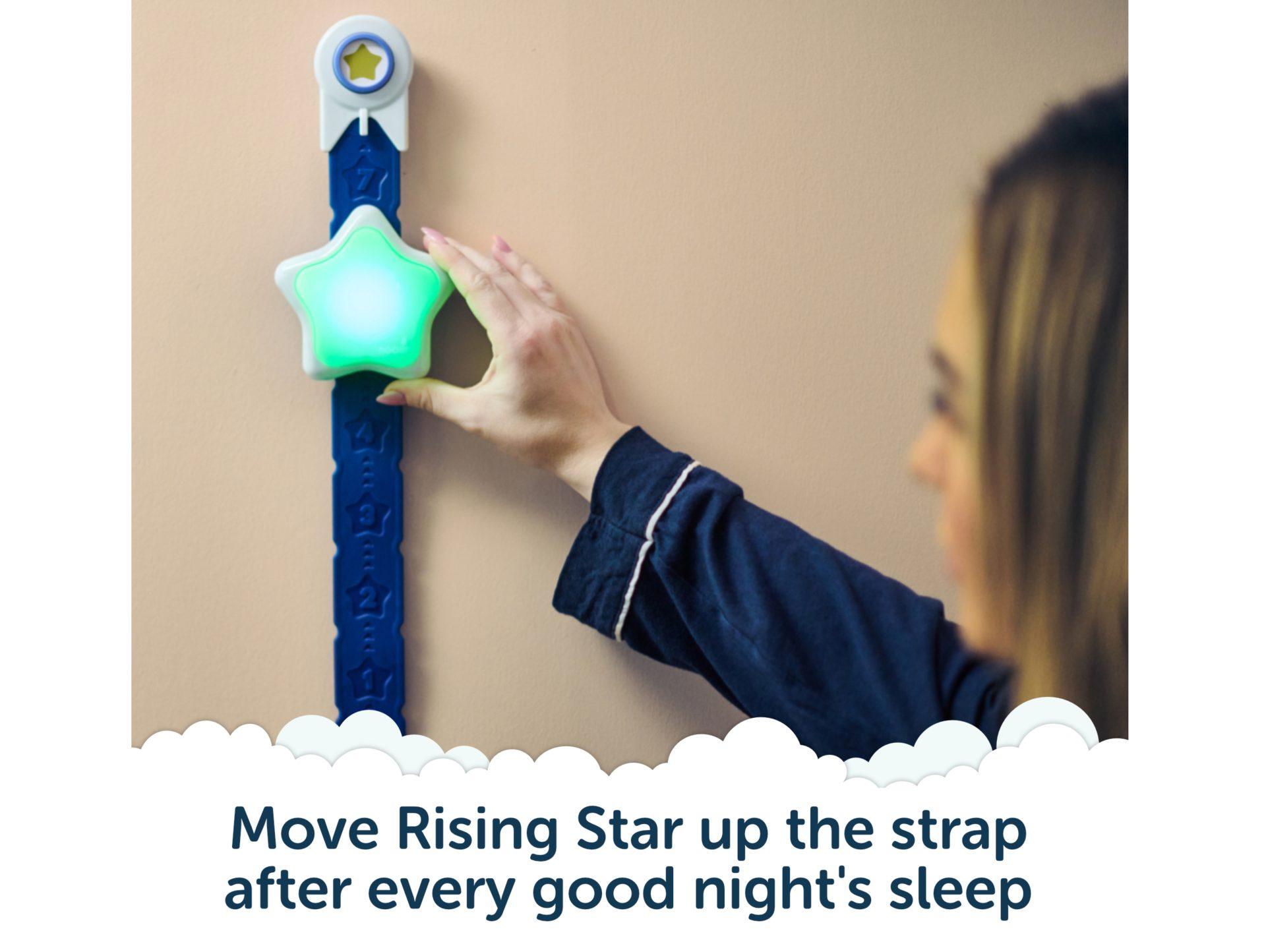 Hand moving the Rising Star up the strap after a good night's sleep.