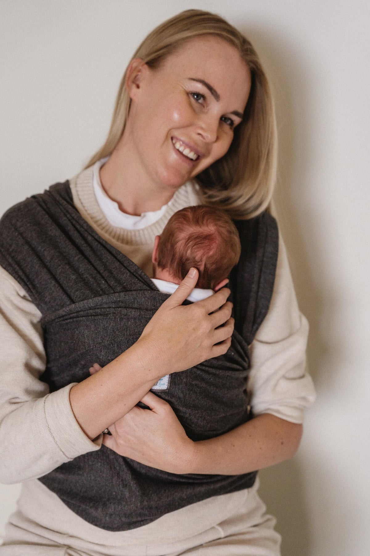 NooNoo Pie Tie baby wrap in Charcoal with newborn