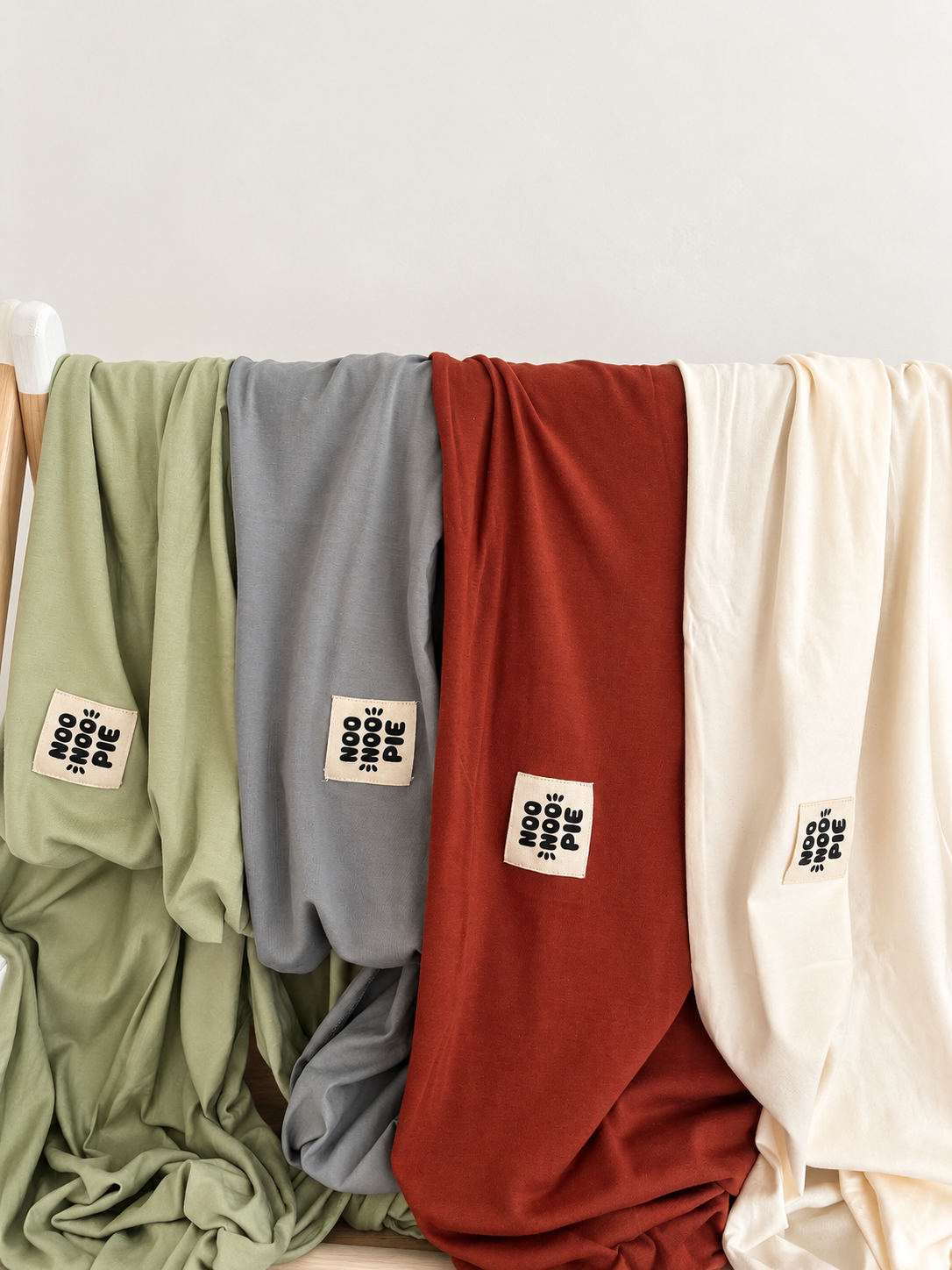 NooNoo Pie Tie baby wraps in Sage, Stone, Sienna and Ivory