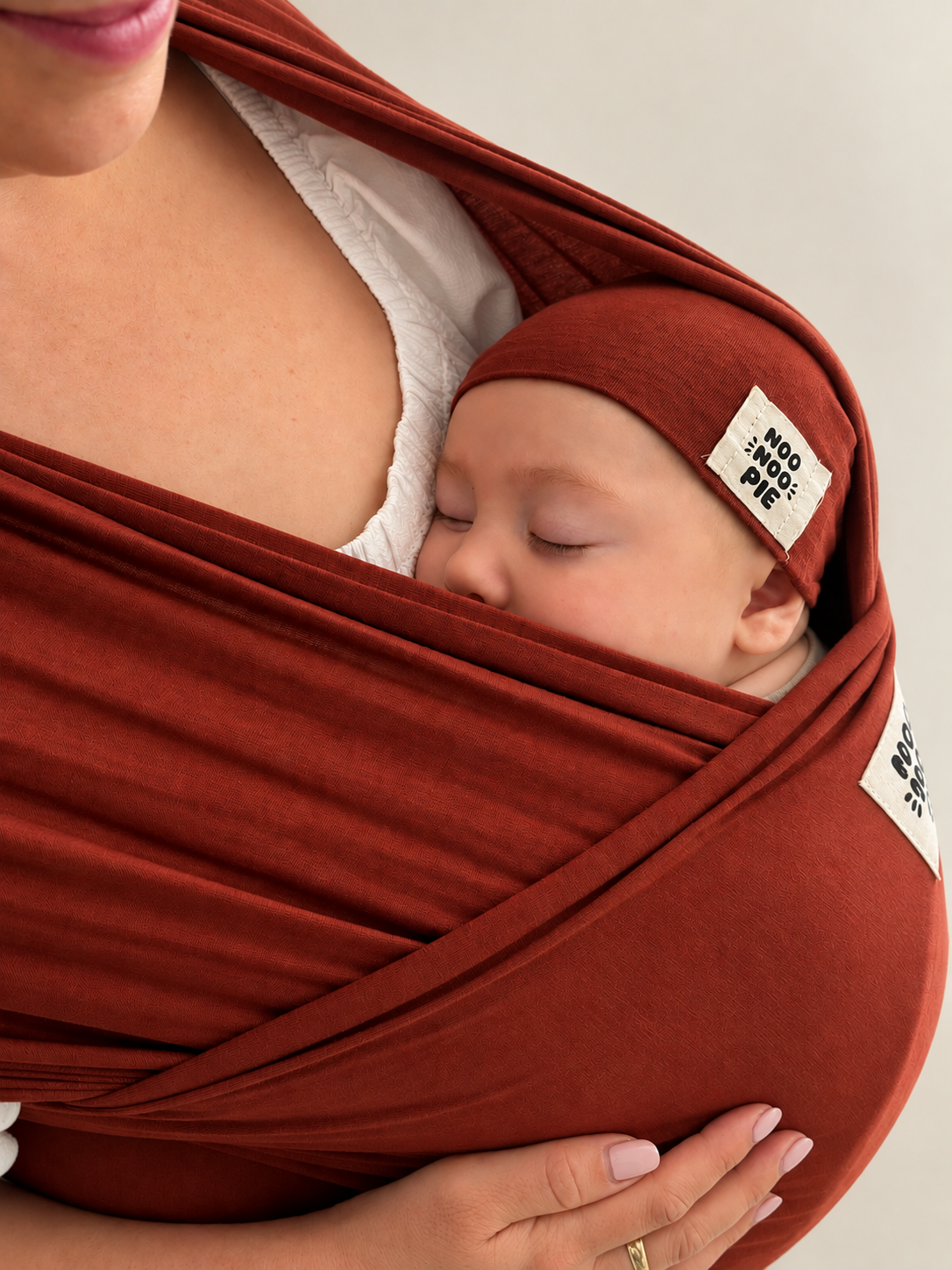 Sleeping baby in a NooNoo Pie Tie wrap in Sienna