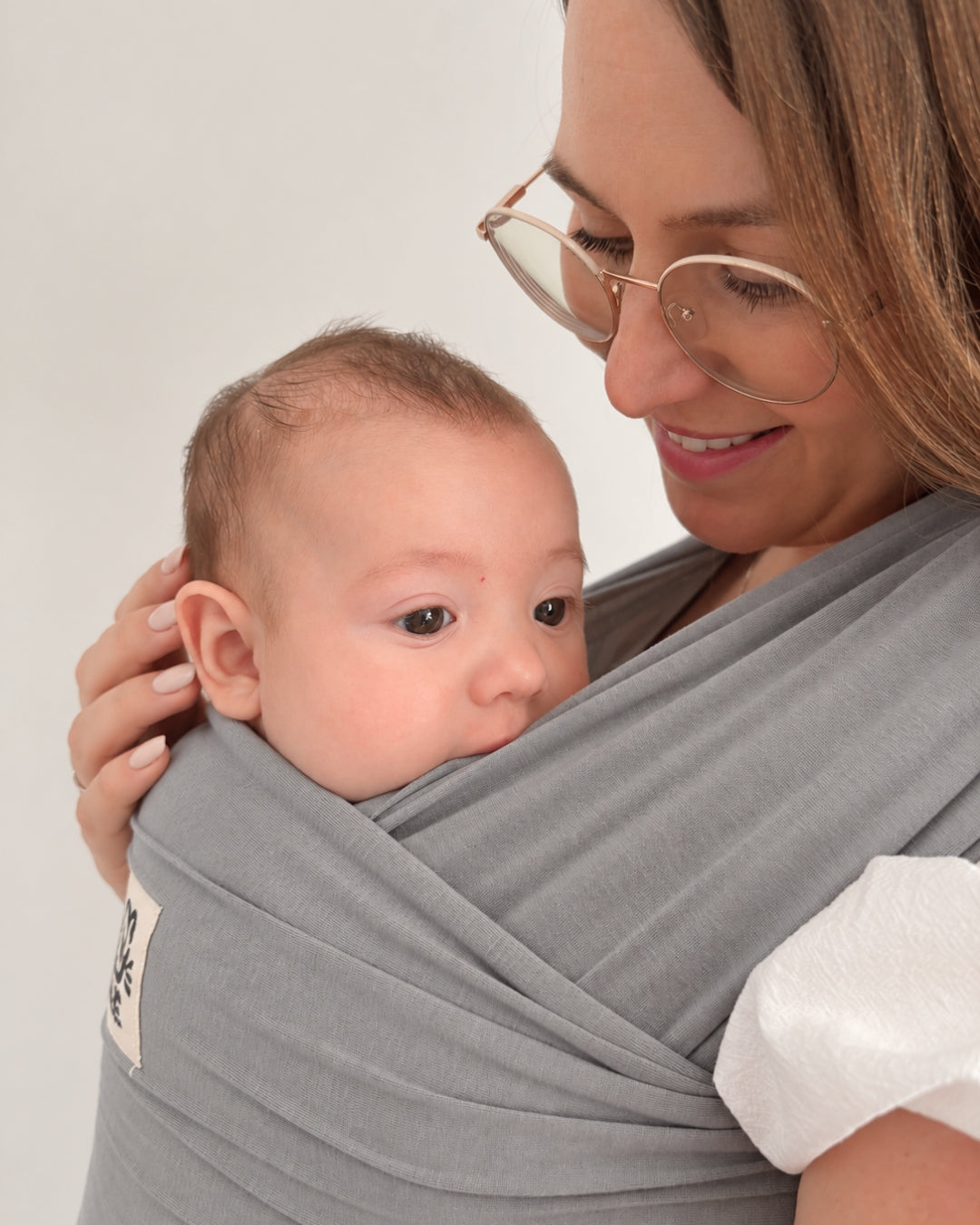 Baby snug in a NooNoo Pie Tie wrap in Stone