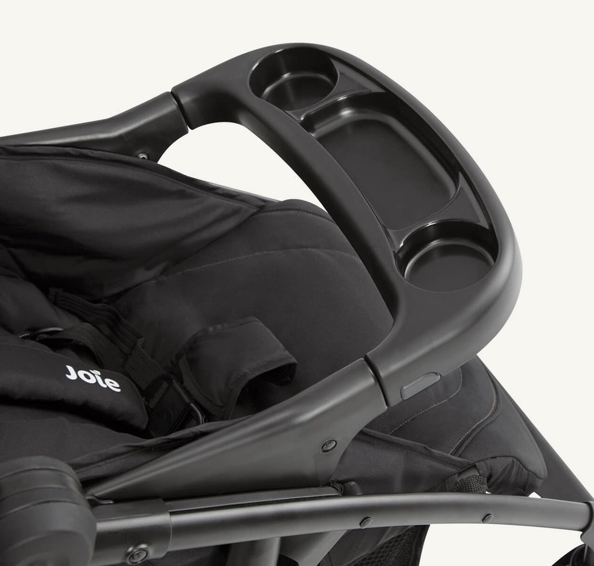 Joie Muze LX travel system in Toffee with stroller frame, seat, and child tray for versatile family travel.