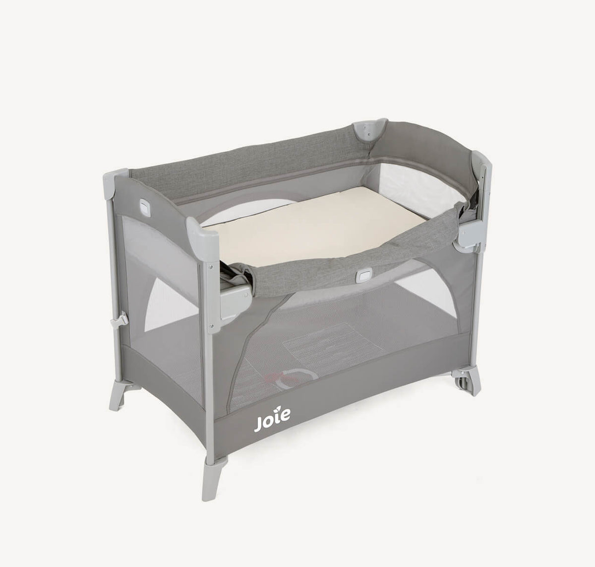 Joie Kubbie Sleep bedside travel cot in foggy grey with drop side, designed for easy portability and safe sleep for infants.
