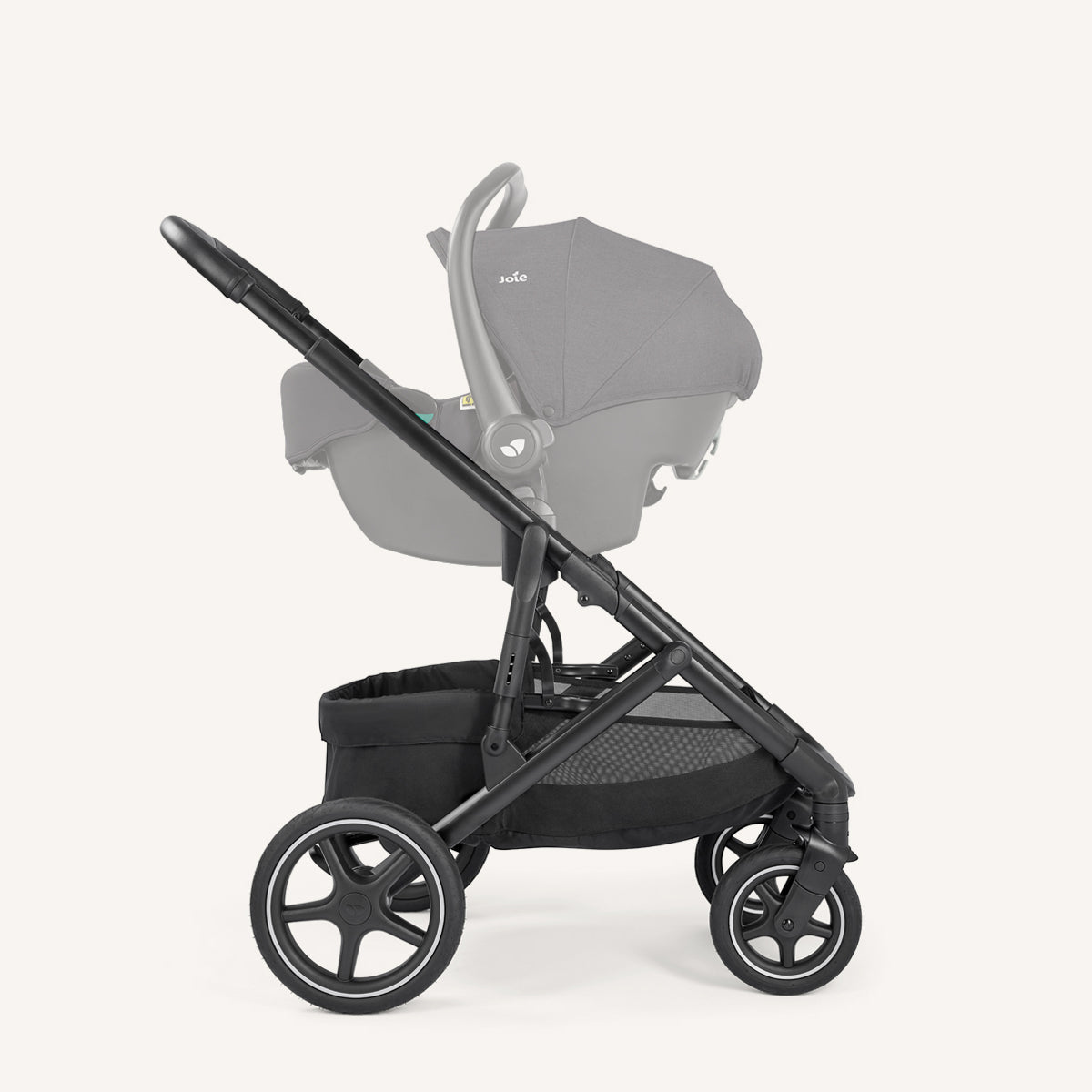Joie Elara all-suspension stroller in Raven with infant car seat attached, showing the right side of the pushchair.