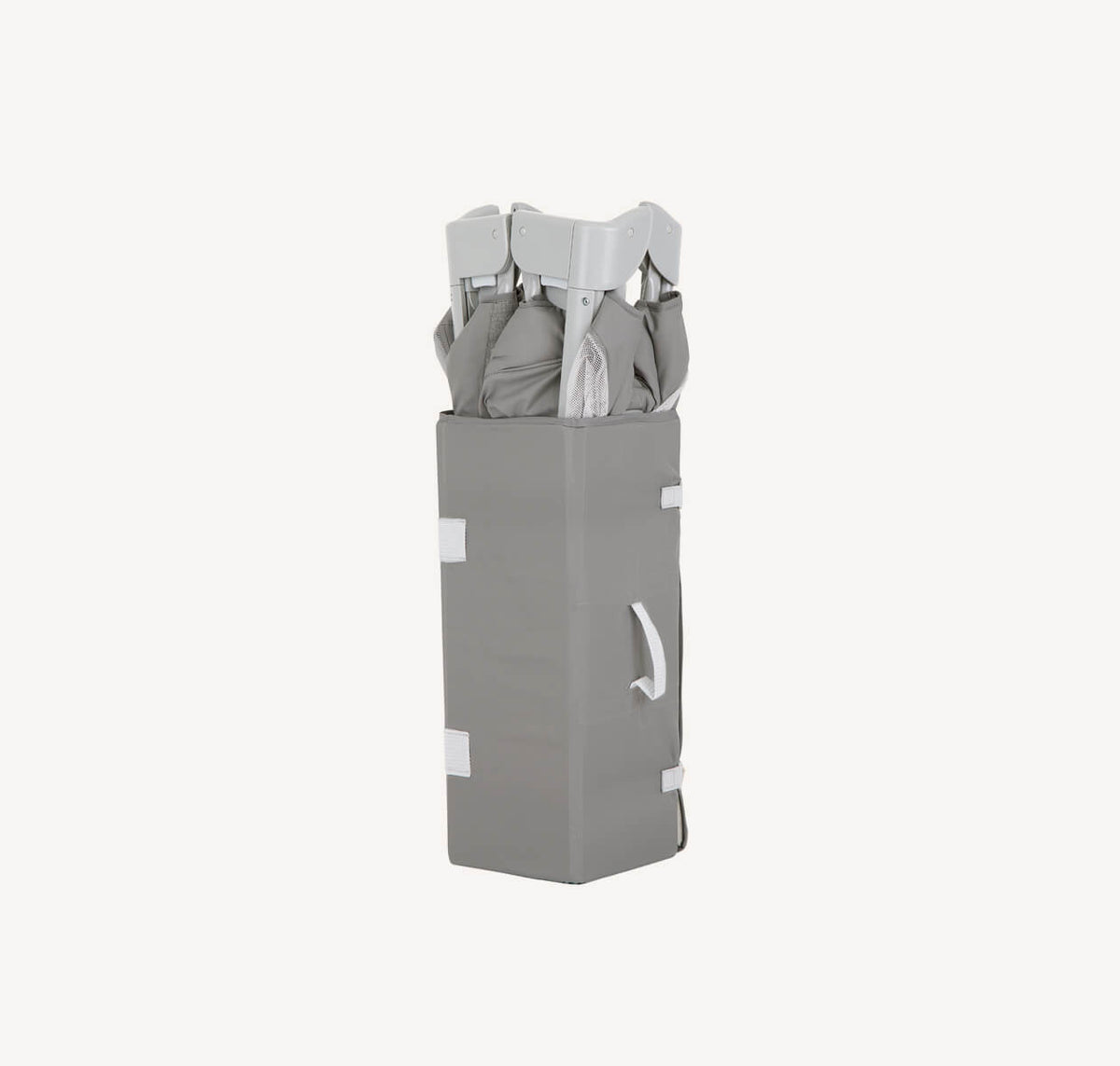 Joie Kubbie Sleep bedside crib and travel cot in foggy grey, folded for portability, suitable for infants and travel.