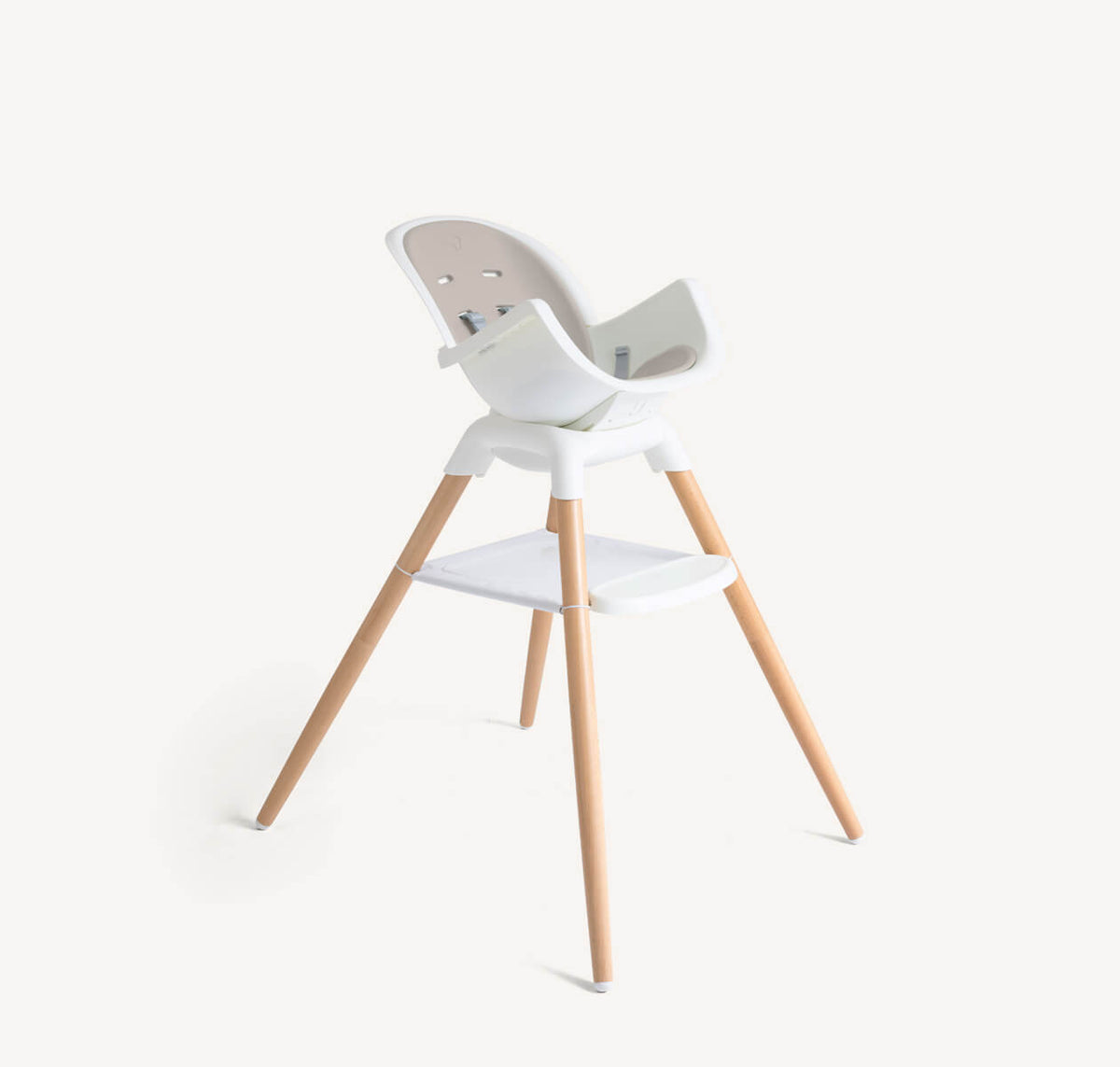 Joie Chestnut Mocha high chair in multi-mode with newborn insert, side view showing adjustable features and comfortable seating.