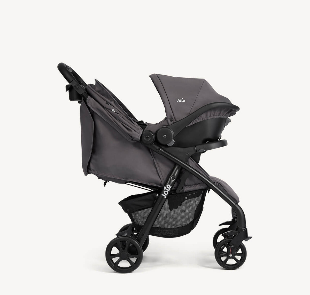 Joie Muze LX Travel System in Thunder color, featuring stroller and car seat, shown from a right-angle view.