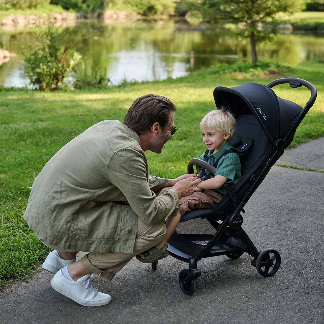 Nuna VIAA cabn Cabin Stroller in Caviar, compact black stroller shown folded