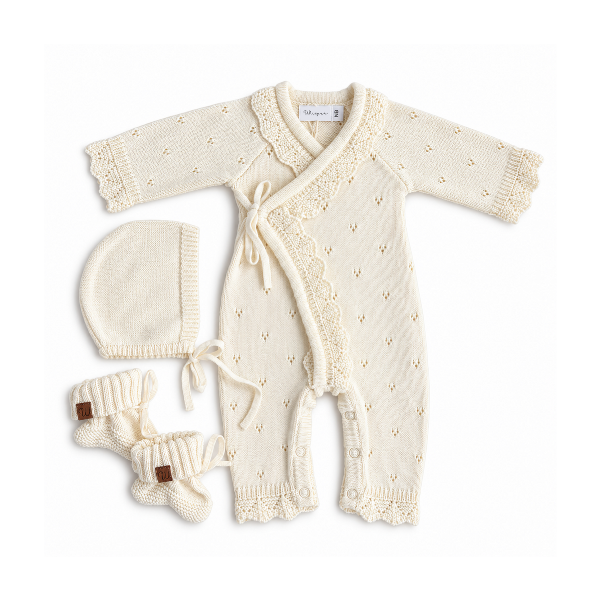 Cream pointelle kimono knitted romper for newborns by Bubbadue, showing soft fabric and cozy design with long sleeves.
