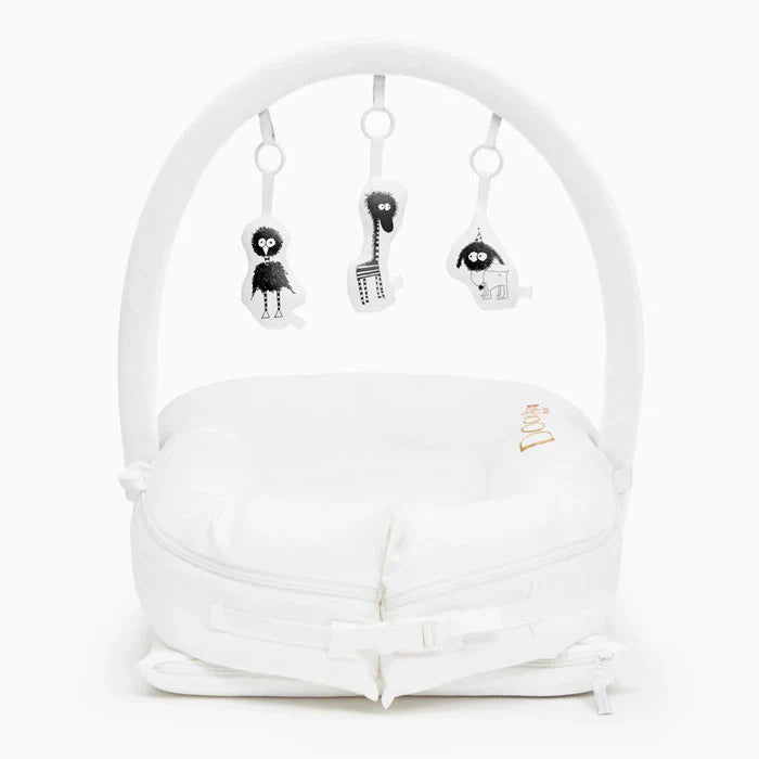 Pristine white Dock-A-Tot Deluxe+ Baby Dock for 0-8 months, soft fabric and comfortable design for infants.