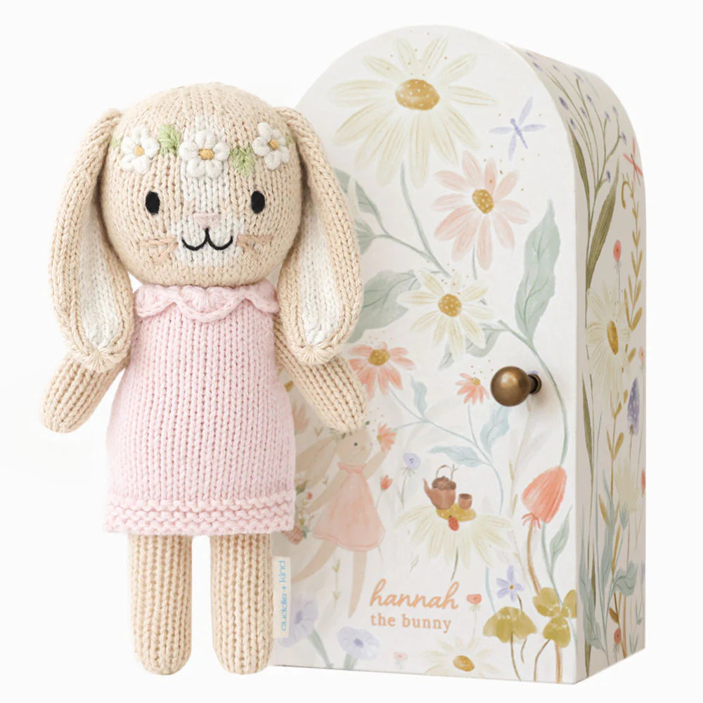 Tiny Hannah the Bunny plush toy in blush pink by Cuddle + Kind, featuring soft fabric and adorable bunny features.