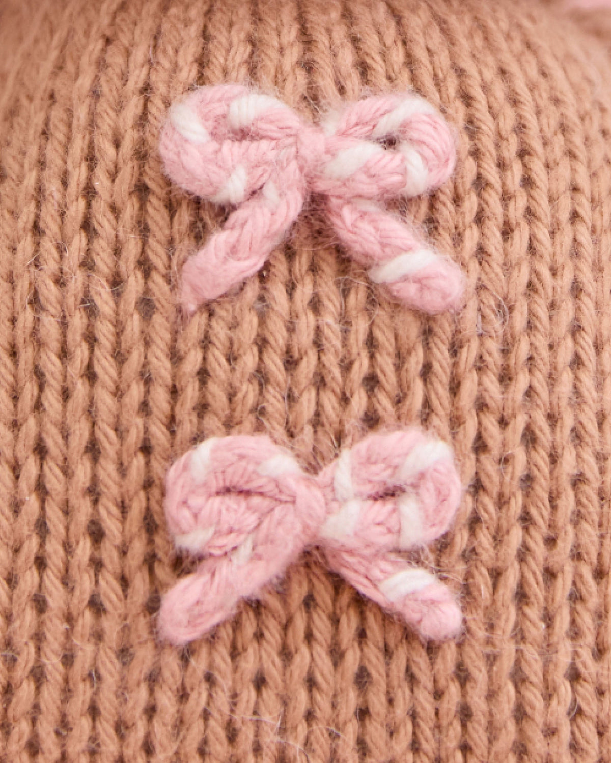 Baby Gingerbread Candy Swirl plush toy by Cuddle + Kind, featuring soft fabric and detailed candy-themed design for children.