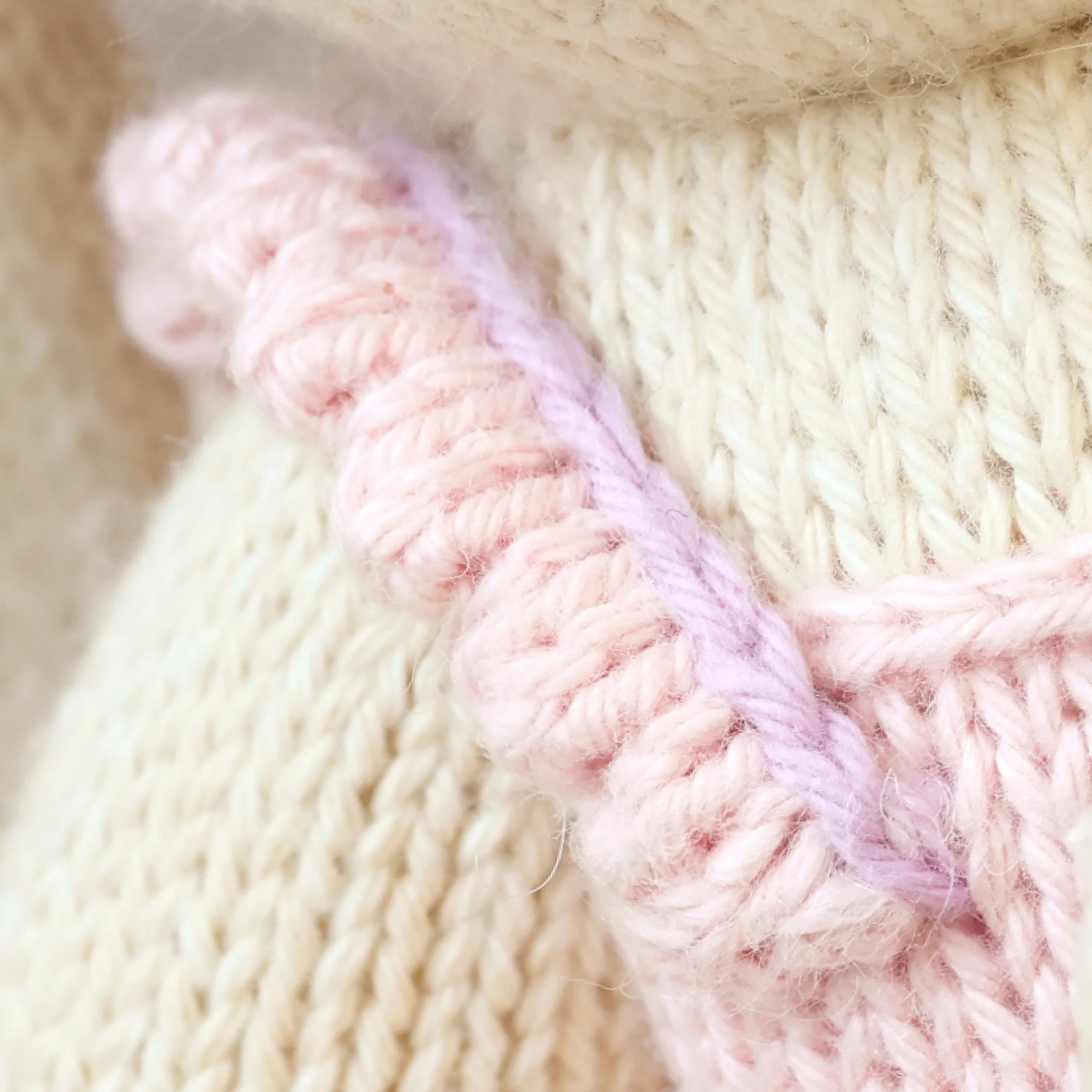 Briar the Bunny in Peony Pink by Cuddle + Kind, a soft plush toy with pink fur and embroidered facial features.