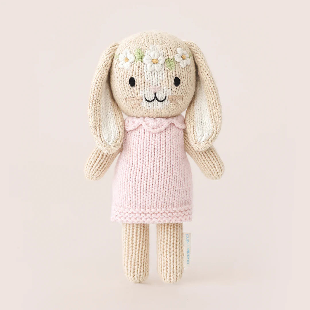 Tiny Hannah the Bunny plush toy in blush pink by Cuddle + Kind, featuring soft fabric and adorable bunny ears.
