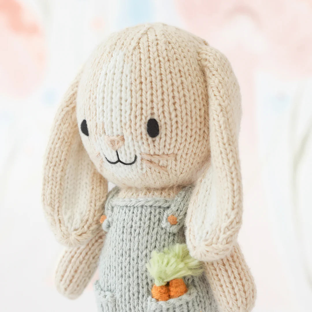 Tiny Henry the Bunny from Cuddle + Kind, soft plush toy with detailed bunny features, ideal for cuddling and caring.