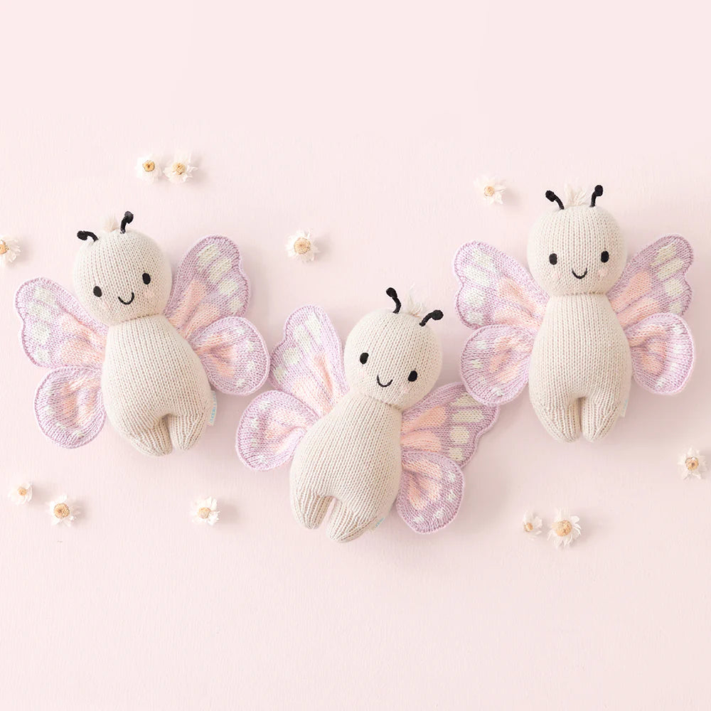 Soft baby butterfly plush toy from Cuddle + Kind featuring colorful butterfly wings and gentle, cuddly design for infants.