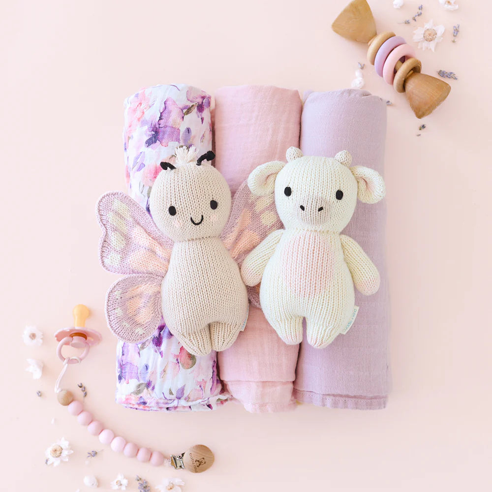 Soft baby butterfly plush toy from Cuddle + Kind featuring gentle pastel colors and detailed butterfly design.